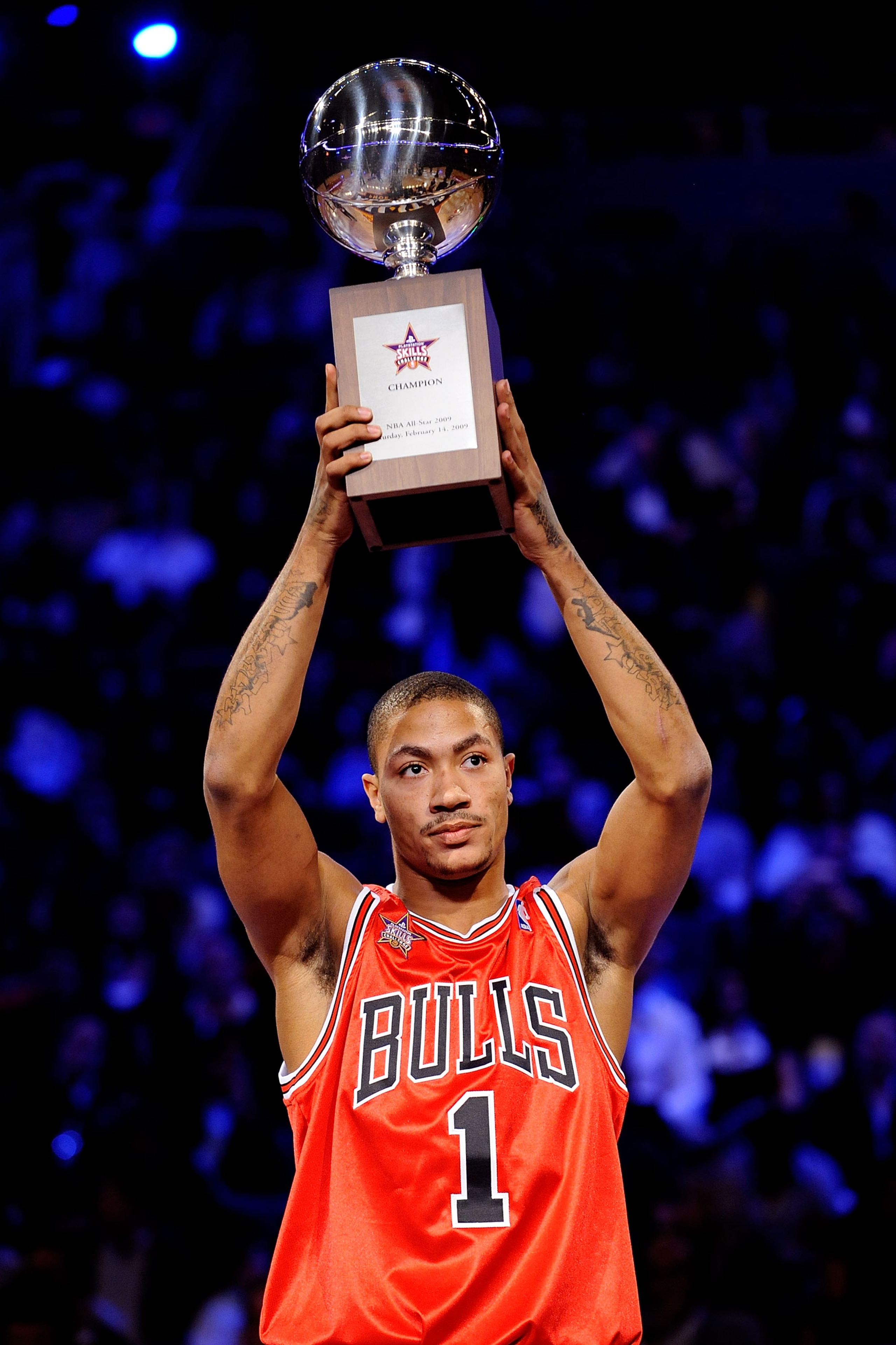 PHOENIX - FEBRUARY 14:  Derrick Rose of the Chicago Bulls holds up the trophy after winning the Play Station Skills Challenge on All-Star Saturday Night, part of 2009 NBA All-Star Weekend at US Airways Center on February 14, 2009 in Phoenix, Arizona.  NOT
