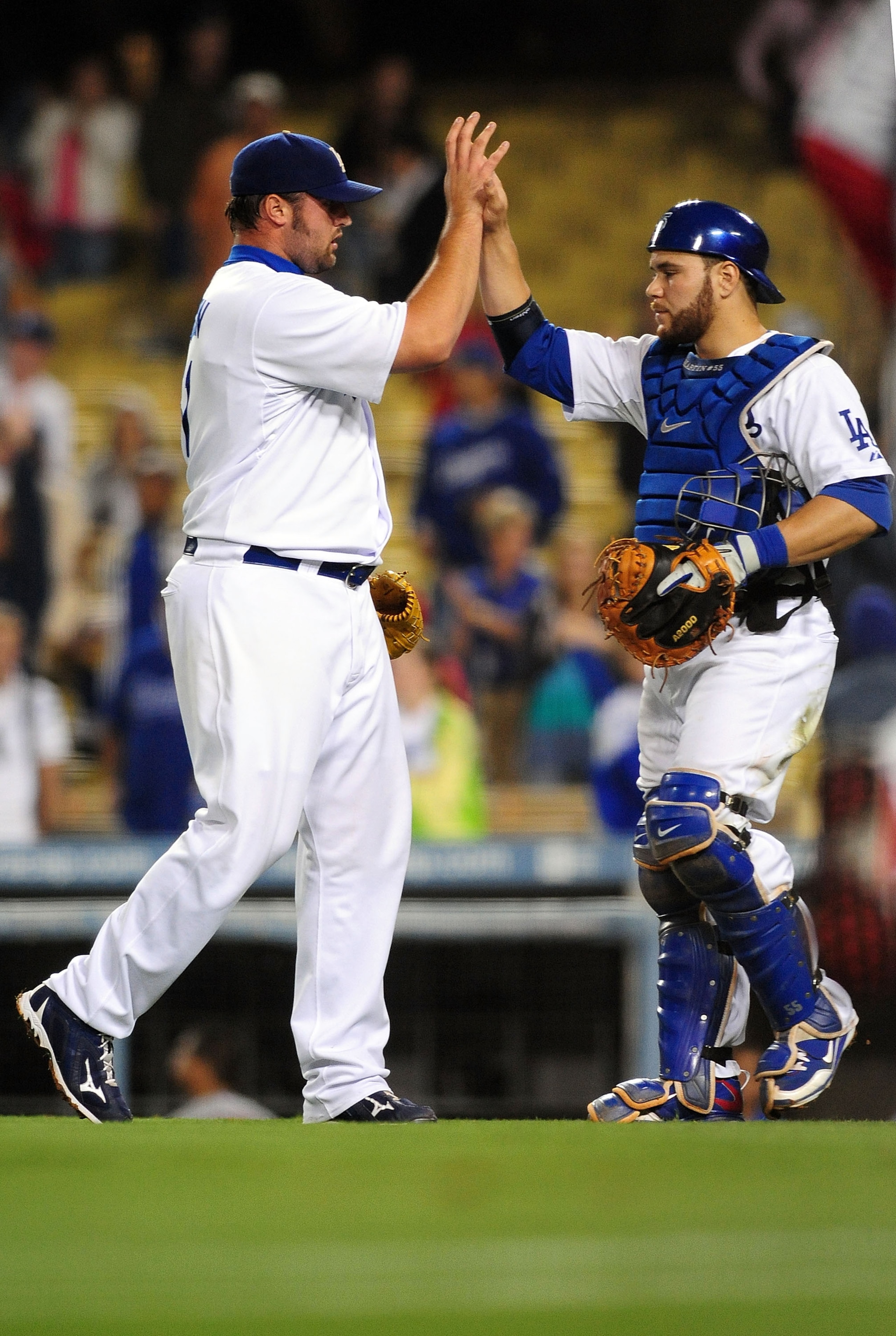 LOS ANGELES, CA - AUGUST 18: Jonathan Broxton #51 and Russell Martin #55 of the Los Angeles Dodgers Celebrate their win  against the St. Louis Cardinals at Dodger Stadium on August 18, 2009 in Los Angeles, California. The Dodgers defeated the Cardinals 7-