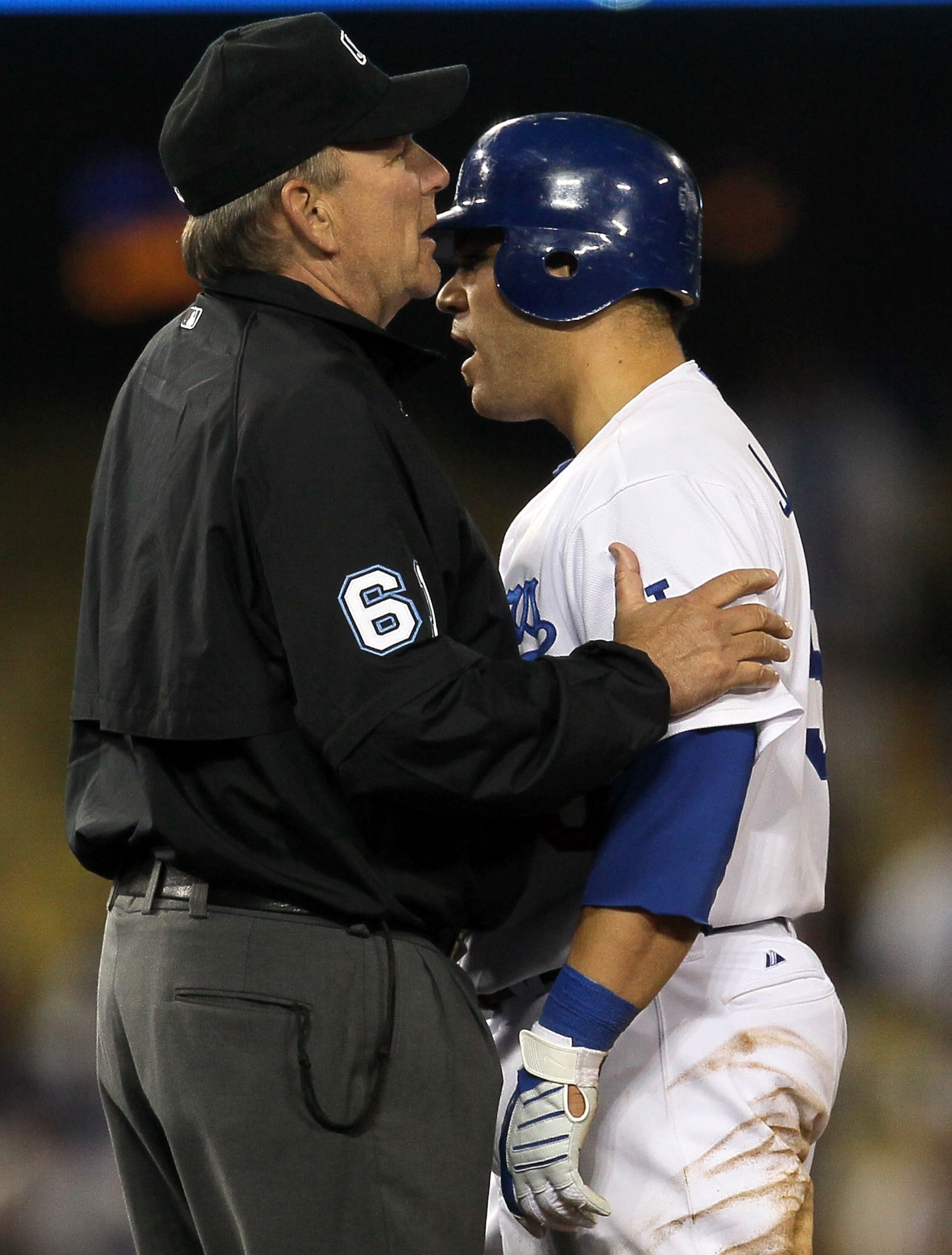 LOS ANGELES - JUNE 1: Russell Martin #55 of the Los Angeles Dodgers is restrained by umpire Bob Davidson as Martin has words with shortstop Stephen Drew of the Arizona Diamondbacks afer Martin was out in a play at second base on June 1, 2010 at Dodger Sta