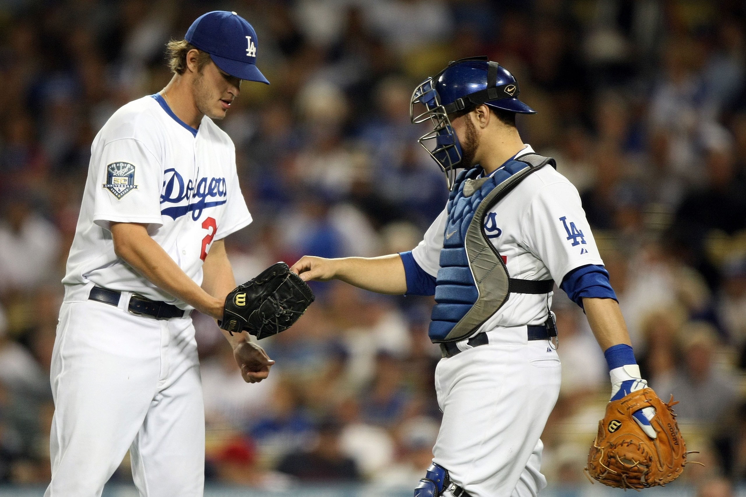 LOS ANGELES, CA - OCTOBER 13:  Clayton Kershaw #22 of the Los Angeles Dodgers is handed the ball by catcher Russell Martin #55 in the first inning against the Philadelphia Phillies in Game Four of the National League Championship Series during the 2008 ML