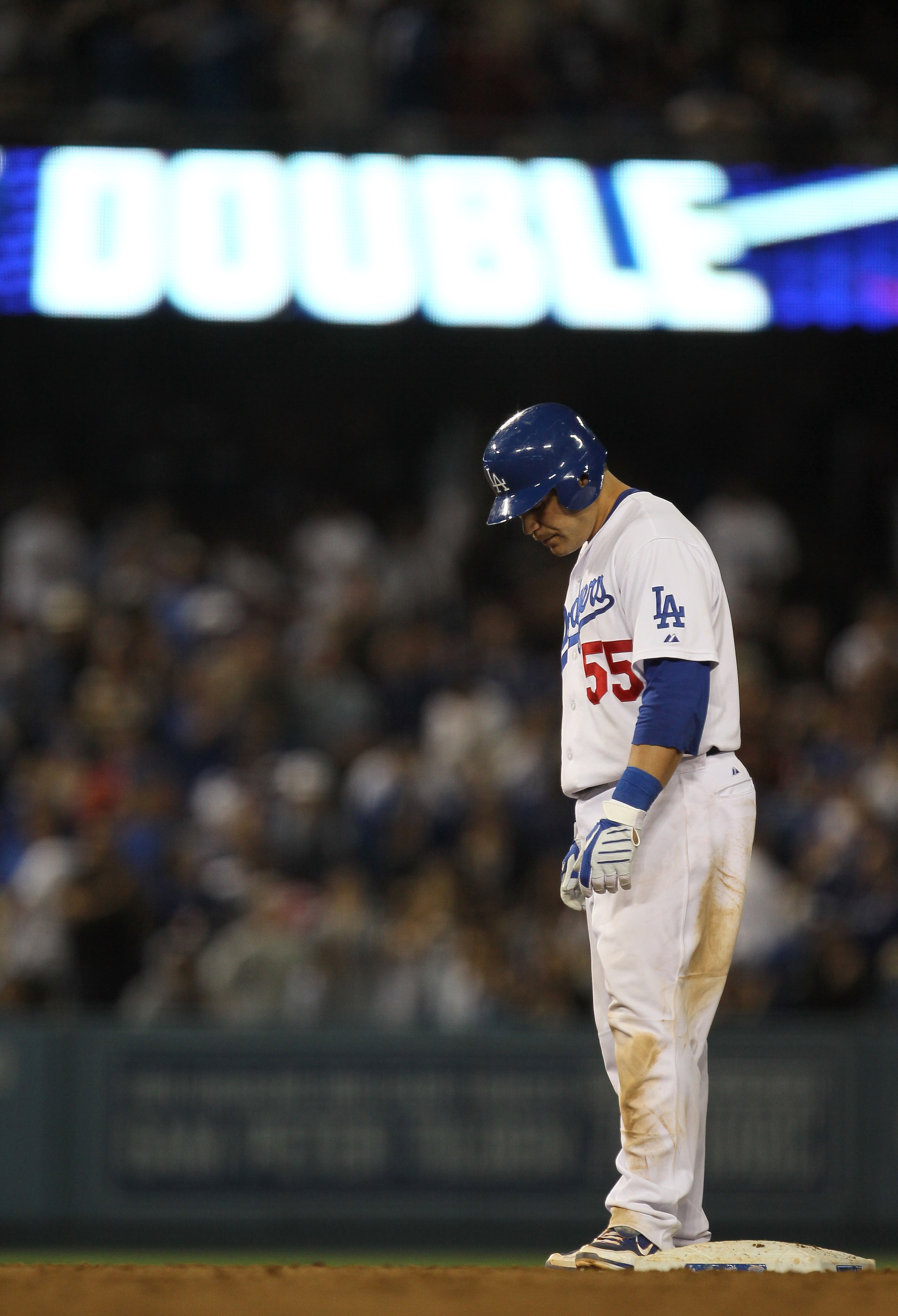 LOS ANGELES - JUNE 12:  Russell Martin #55 of the Los Angeles Dodgers stands on second base after hitting a two RBI double in the fifth inning against the Los Angeles Angels of Anaheim on June 12, 2010 at Dodger Stadium in Los Angeles, California.   (Phot