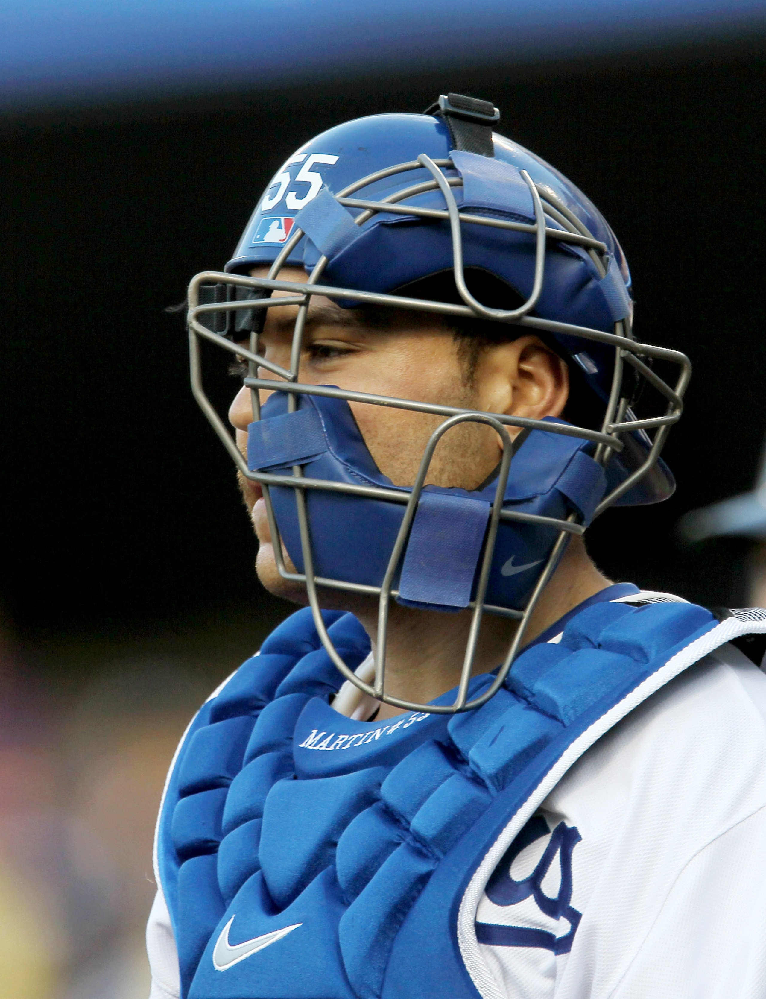 LOS ANGELES - JULY 5: Catcher Russell Martin of the Los Angeles Dodgers stands with his mask askew after his throwing error allowed a run to score in the second inning against the Florida Marlins on July 5, 2010 at Dodger Stadium in Los Angeles, Californi