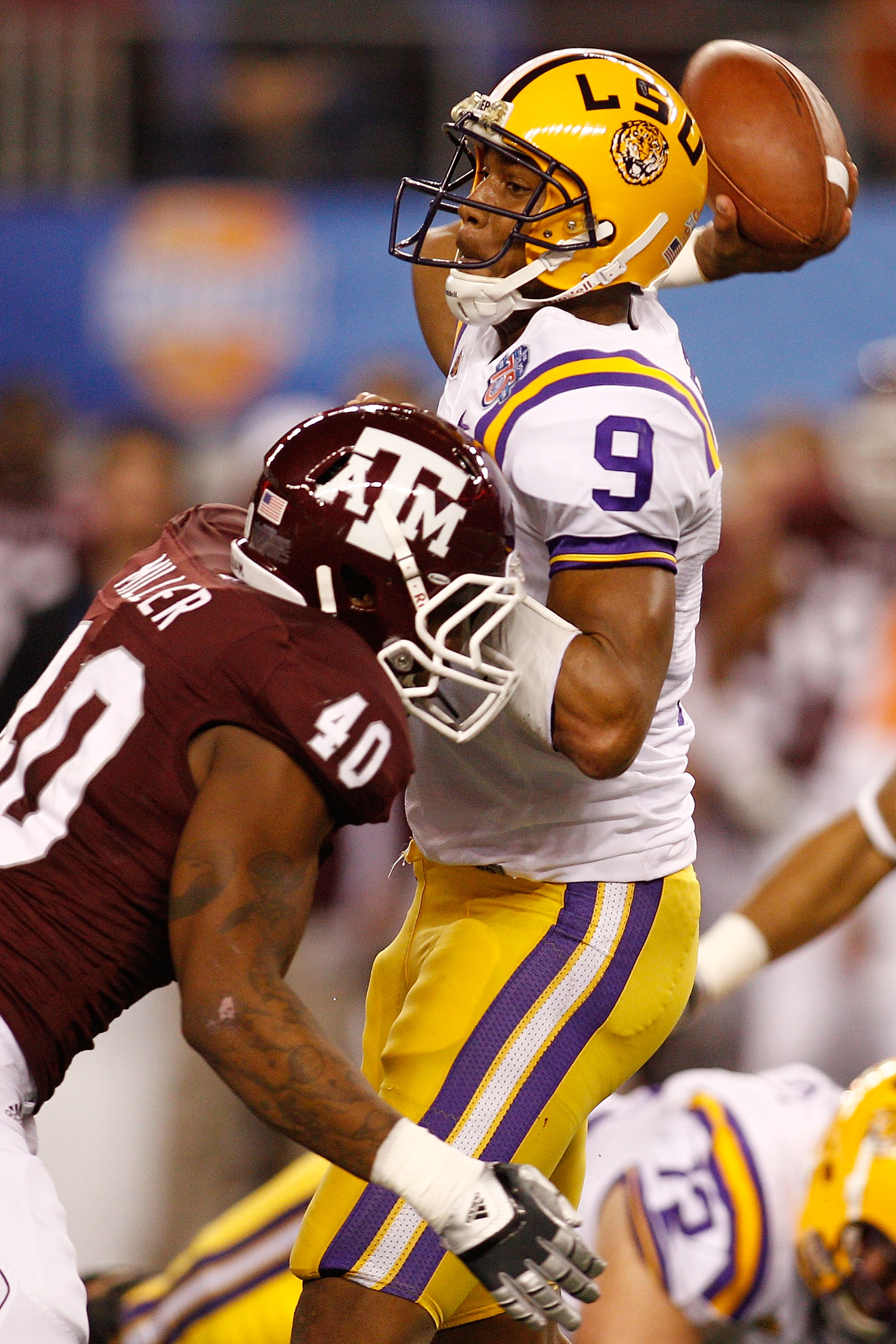 ARLINGTON, TX - JANUARY 07:  Jordan Jefferson #9 of the Louisiana State University Tigers throws under pressure from Von Miller #40 of the Texas A&M Aggies during the AT&T Cotton Bowl at Cowboys Stadium on January 7, 2011 in Arlington, Texas.  (Photo by C