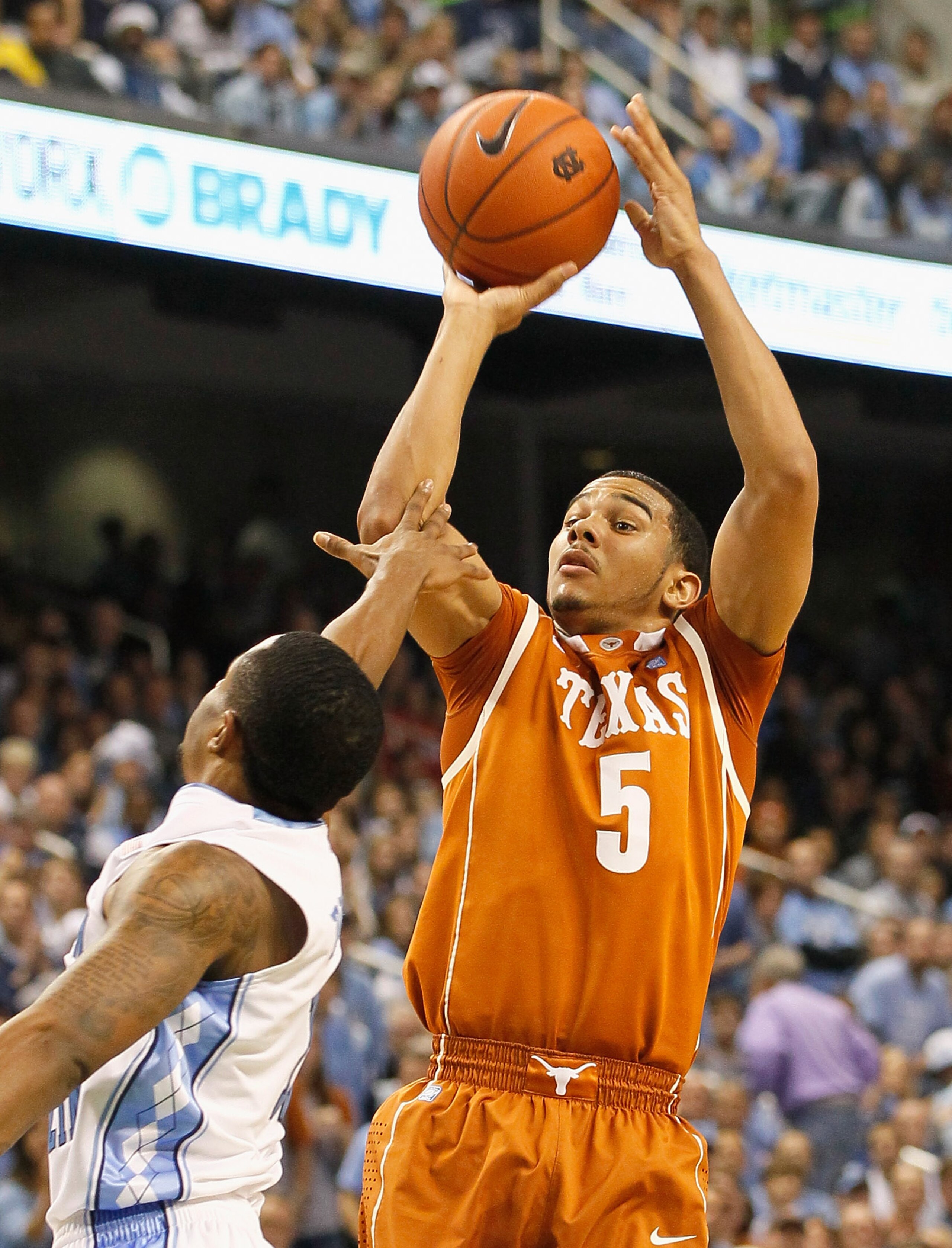 GREENSBORO, NC - DECEMBER 18:  Cory Joseph #5 of the Texas Longhorns shoots over Larry Drew II #11 of the North Carolina Tar Heels at Greensboro Coliseum on December 18, 2010 in Greensboro, North Carolina.  (Photo by Kevin C. Cox/Getty Images)