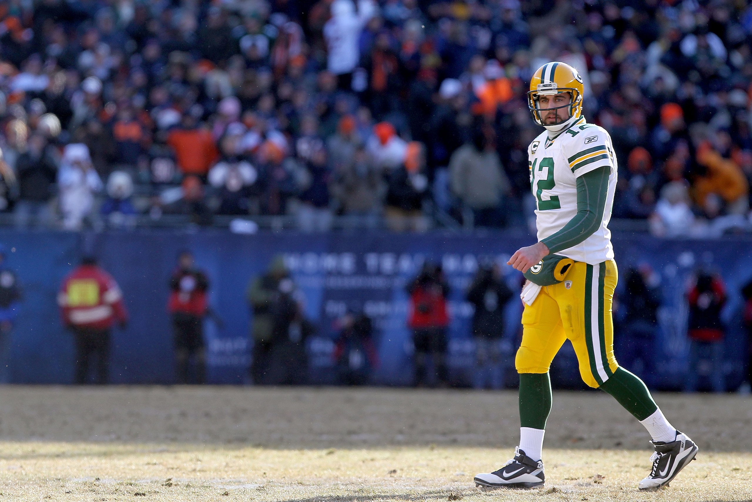 CHICAGO, IL - JANUARY 23:  Quarterback Aaron Rodgers #12 of the Green Bay Packers walks on the field in the first quarter against the Chicago Bears in the NFC Championship Game at Soldier Field on January 23, 2011 in Chicago, Illinois.  (Photo by Doug Pen