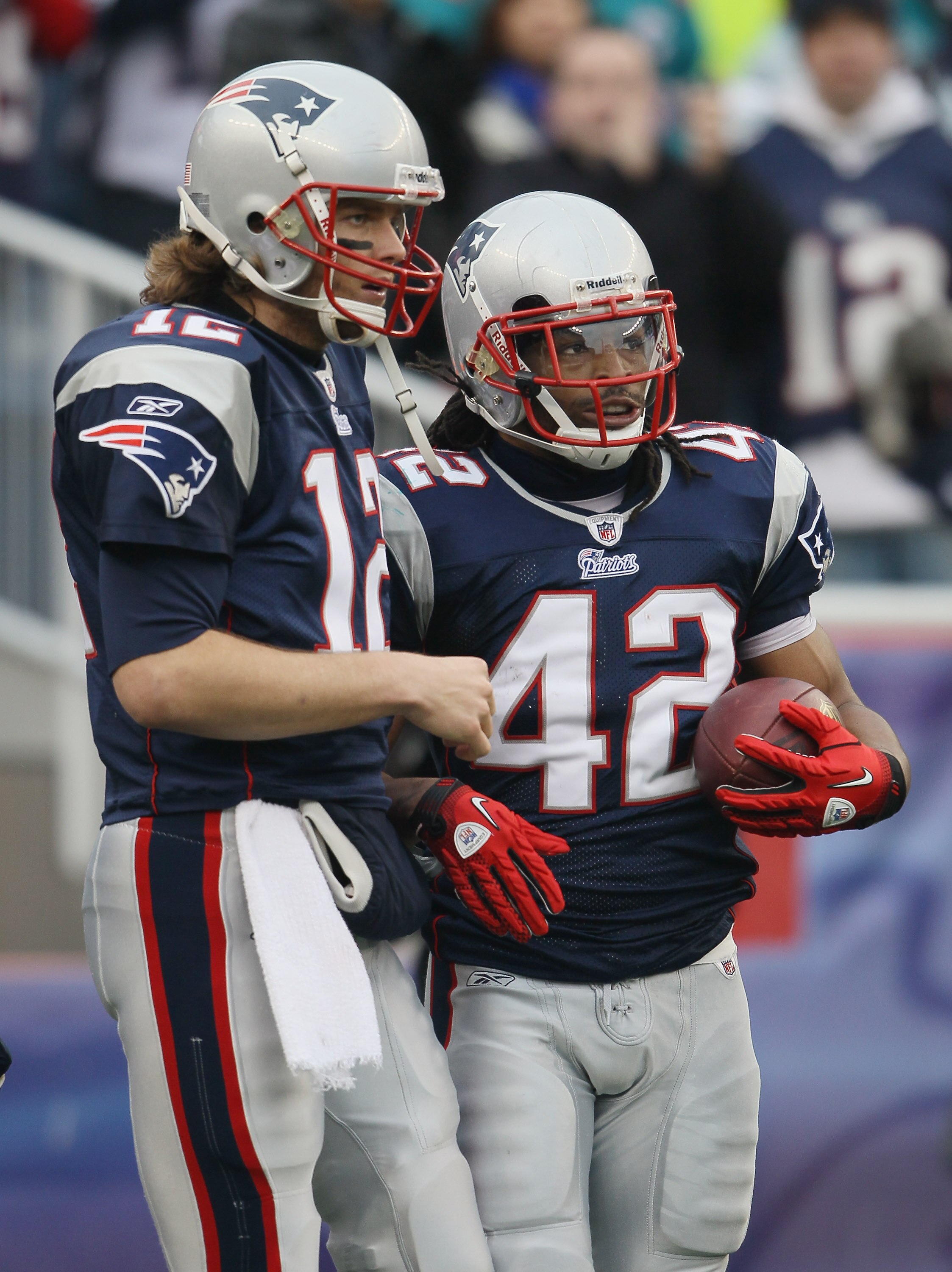 FOXBORO, MA - JANUARY 02:  Tom Brady #12 of the New England Patriots and BenJarvus Green-Ellis #42 celebrate the touchdown in the first half against the Miami Dolphins on January 2, 2011 at Gillette Stadium in Foxboro, Massachusetts.  (Photo by Elsa/Getty
