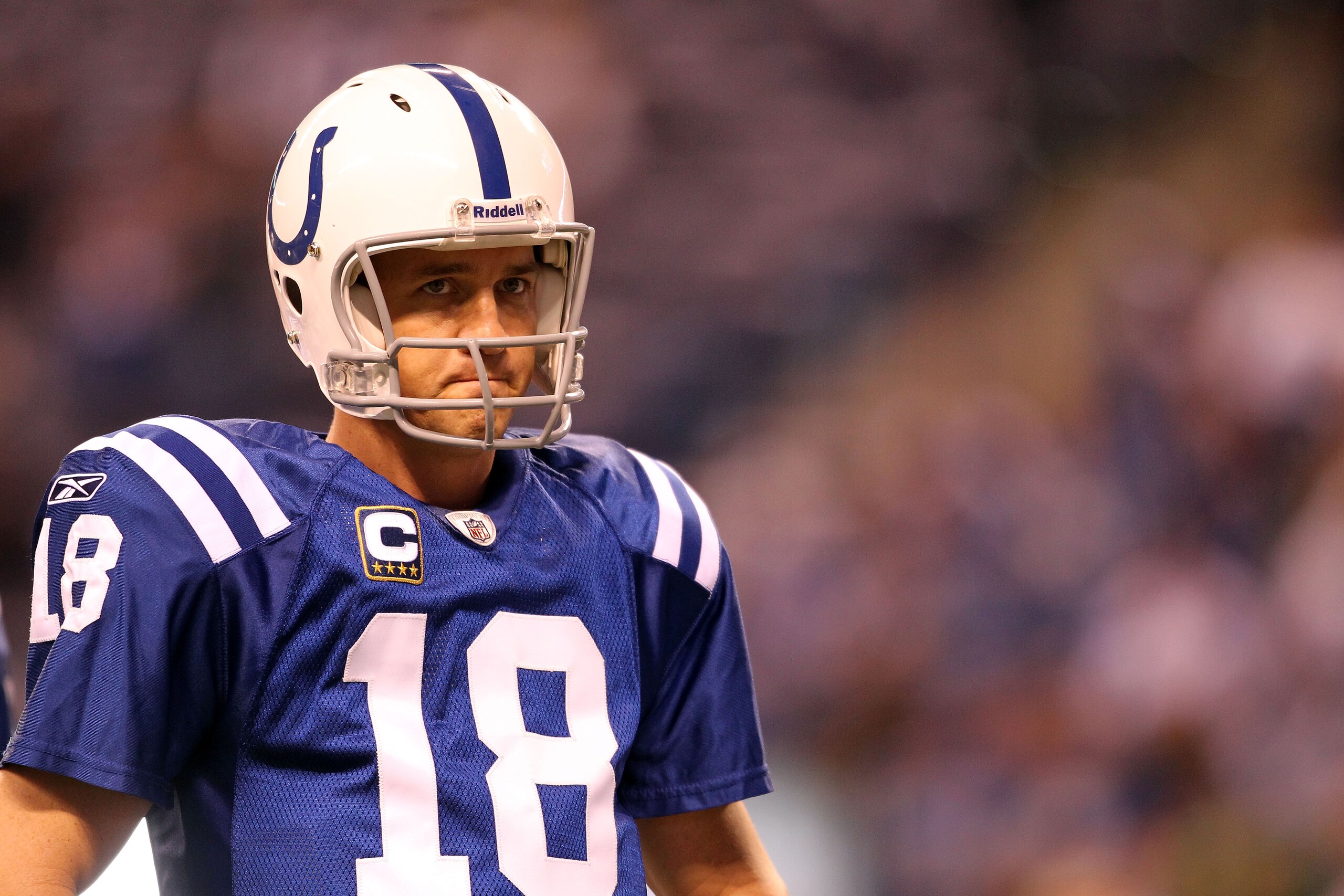 INDIANAPOLIS, IN - JANUARY 08: Quarterback Peyton Manning #18 of the Indianapolis Colts looks on against the New York Jets during their 2011 AFC wild card playoff game at Lucas Oil Stadium on January 8, 2011 in Indianapolis, Indiana. The Jets won 17-16. INDIANAPOLIS, IN - JANUARY 08: Quarterback Peyton Manning #18 of the Indianapolis Colts looks on against the New York Jets during their 2011 AFC wild card playoff game at Lucas Oil Stadium on January 8, 2011 in Indianapolis, Indiana. The Jets won 17-16.