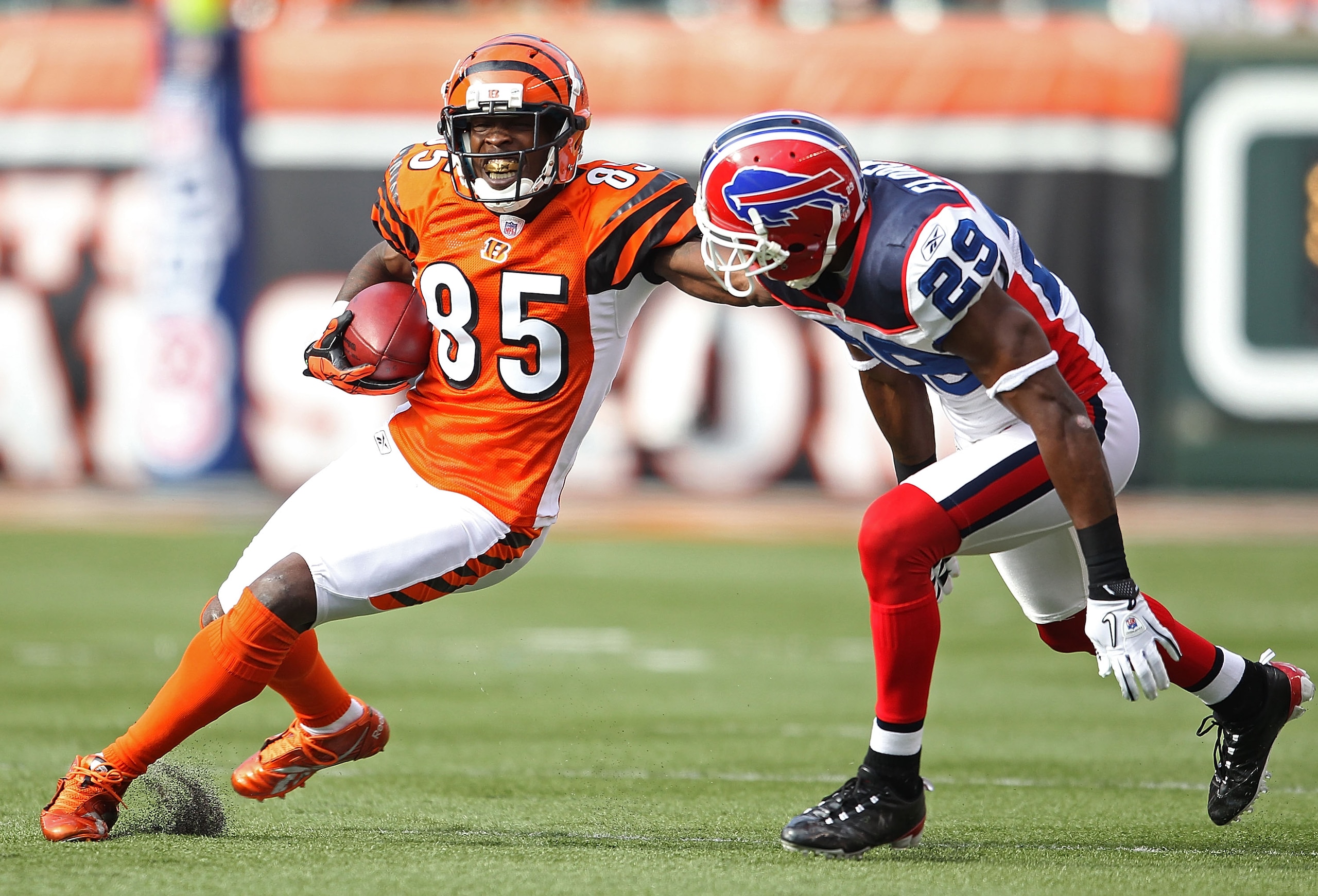 CINCINNATI - NOVEMBER 21: Chad Ochocinco #85 of the Cincinnati Bengals runs with the ball while defended by Drayton Florence #29 of the Buffalo Bills during the NFL game at Paul Brown Stadium on November 21, 2010 in Cincinnati, Ohio. The Bills won 49-3 CINCINNATI - NOVEMBER 21: Chad Ochocinco #85 of the Cincinnati Bengals runs with the ball while defended by Drayton Florence #29 of the Buffalo Bills during the NFL game at Paul Brown Stadium on November 21, 2010 in Cincinnati, Ohio. The Bills won 49-3