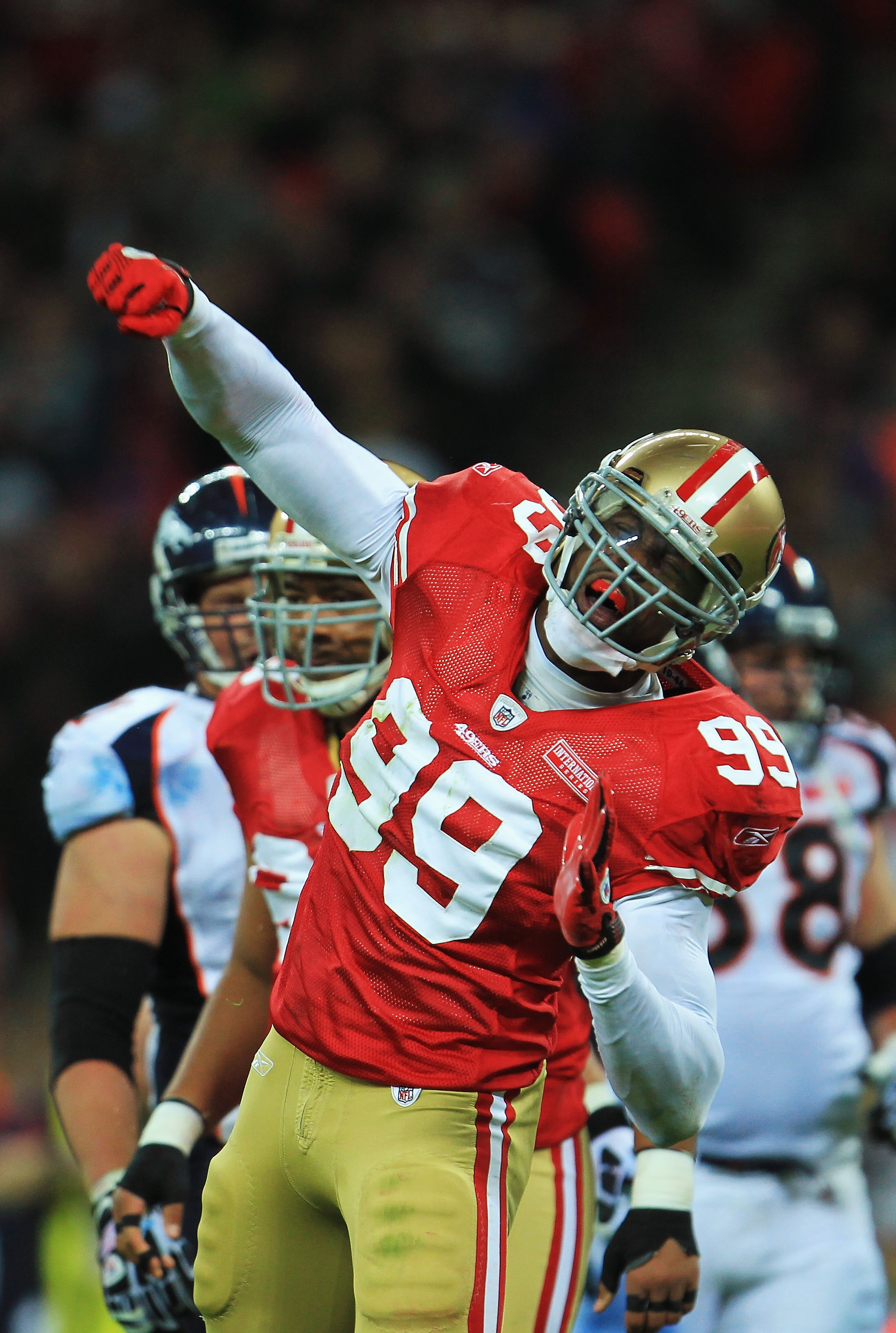 LONDON, ENGLAND - OCTOBER 31:  Manny Lawson #99 of San Francisco 49ers celebrates as he sacks Kyle Orton #8 of Denver Broncos during the NFL International Series match between Denver Broncos and San Francisco 49ers at Wembley Stadium on October 31, 2010 i