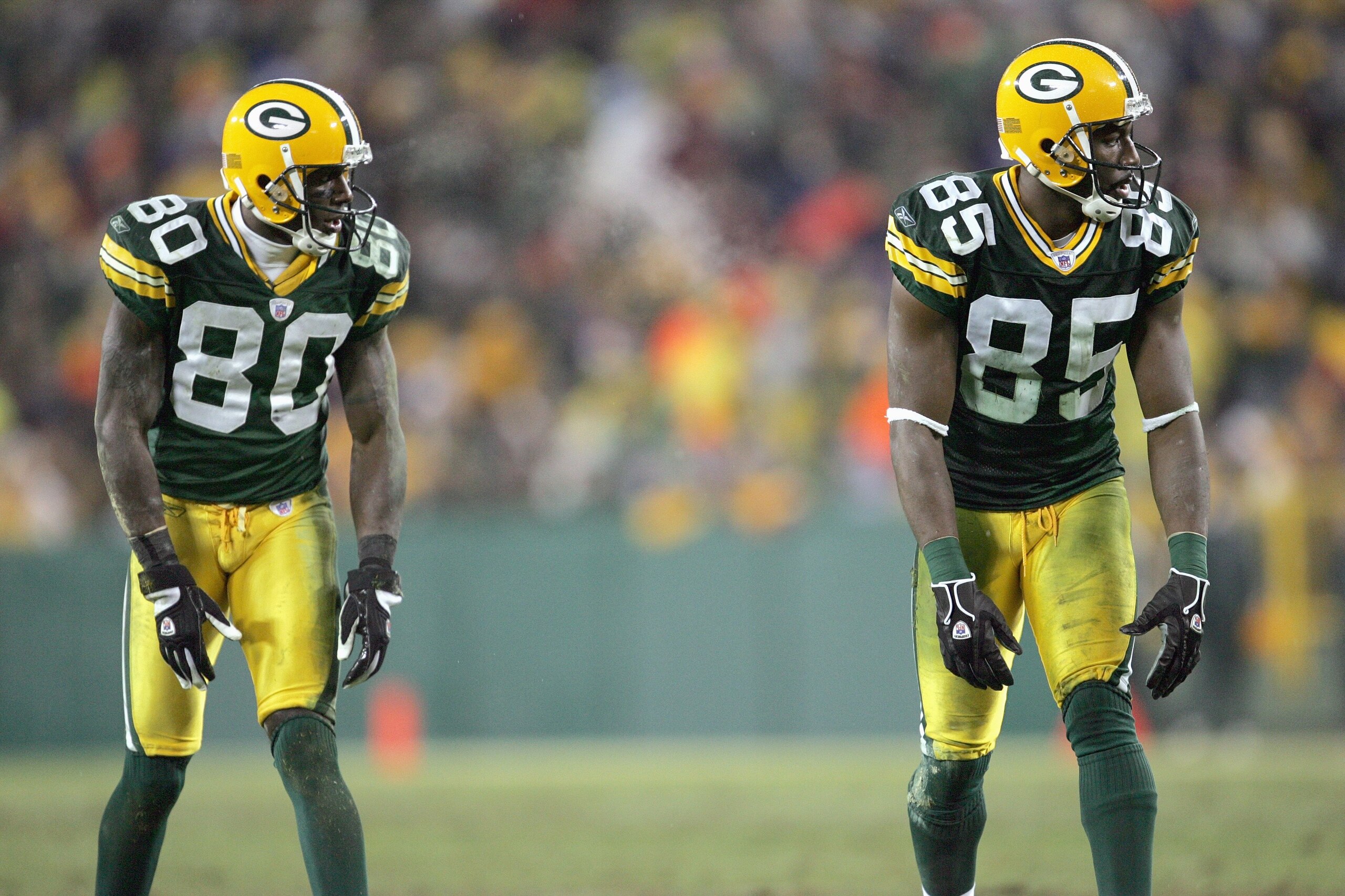 GREEN BAY, WI - DECEMBER 21: Donald Driver #80 and Greg Jennings #85 of the Green Bay Packers gets ready to move at the snap during the game against the Minnesota Vikings on December 21, 2006 at Lambeau Field in Green Bay, Wisconsin. The Packers defeated