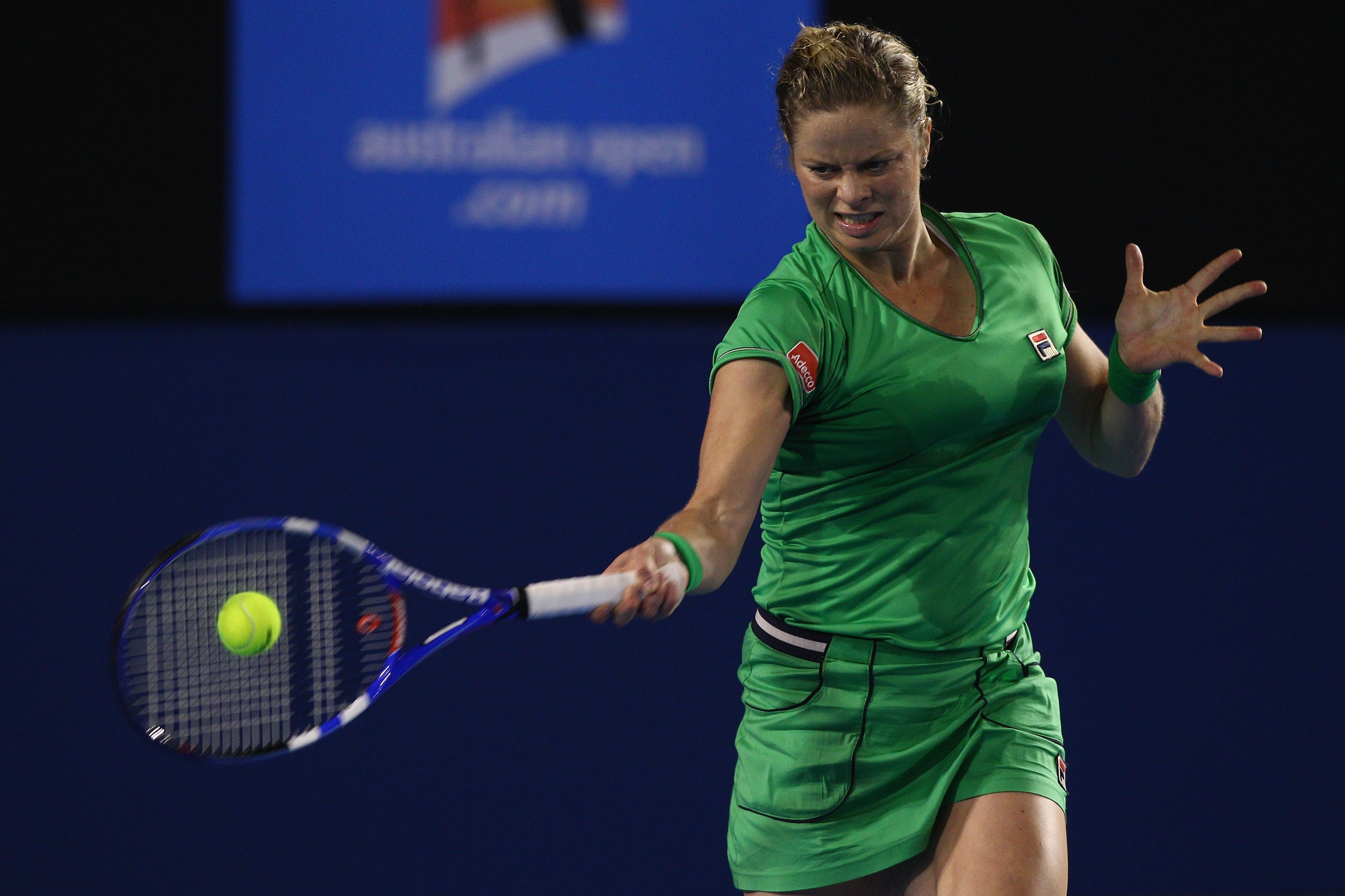 MELBOURNE, AUSTRALIA - JANUARY 24:  Kim Clijsters of Belgium plays a forehand in her fourth round match against Ekaterina Makarova of Russia during day eight of the 2011 Australian Open at Melbourne Park on January 24, 2011 in Melbourne, Australia.  (Phot