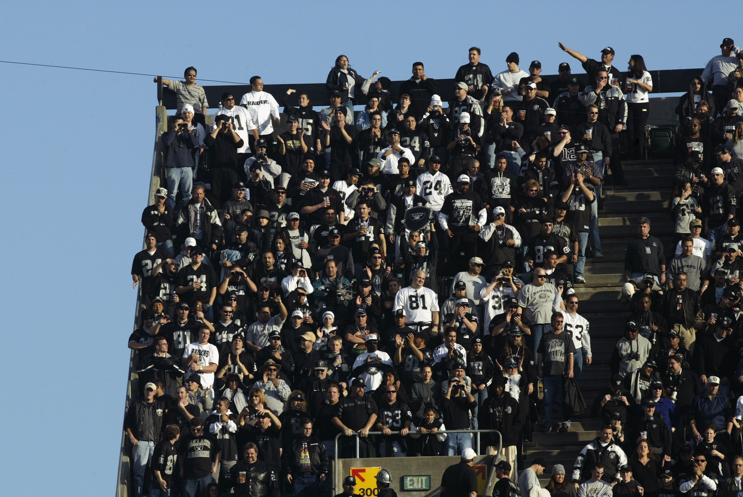 OAKLAND, CA - JANUARY 19:  Fans of the Oakland Raiders fill even the 'nose-bleed' seats during the AFC Championship game against the Tennessee Titans at Network Associates Coliseum on January 19, 2003 in Oakland, California.  The Raiders defeated the Tita