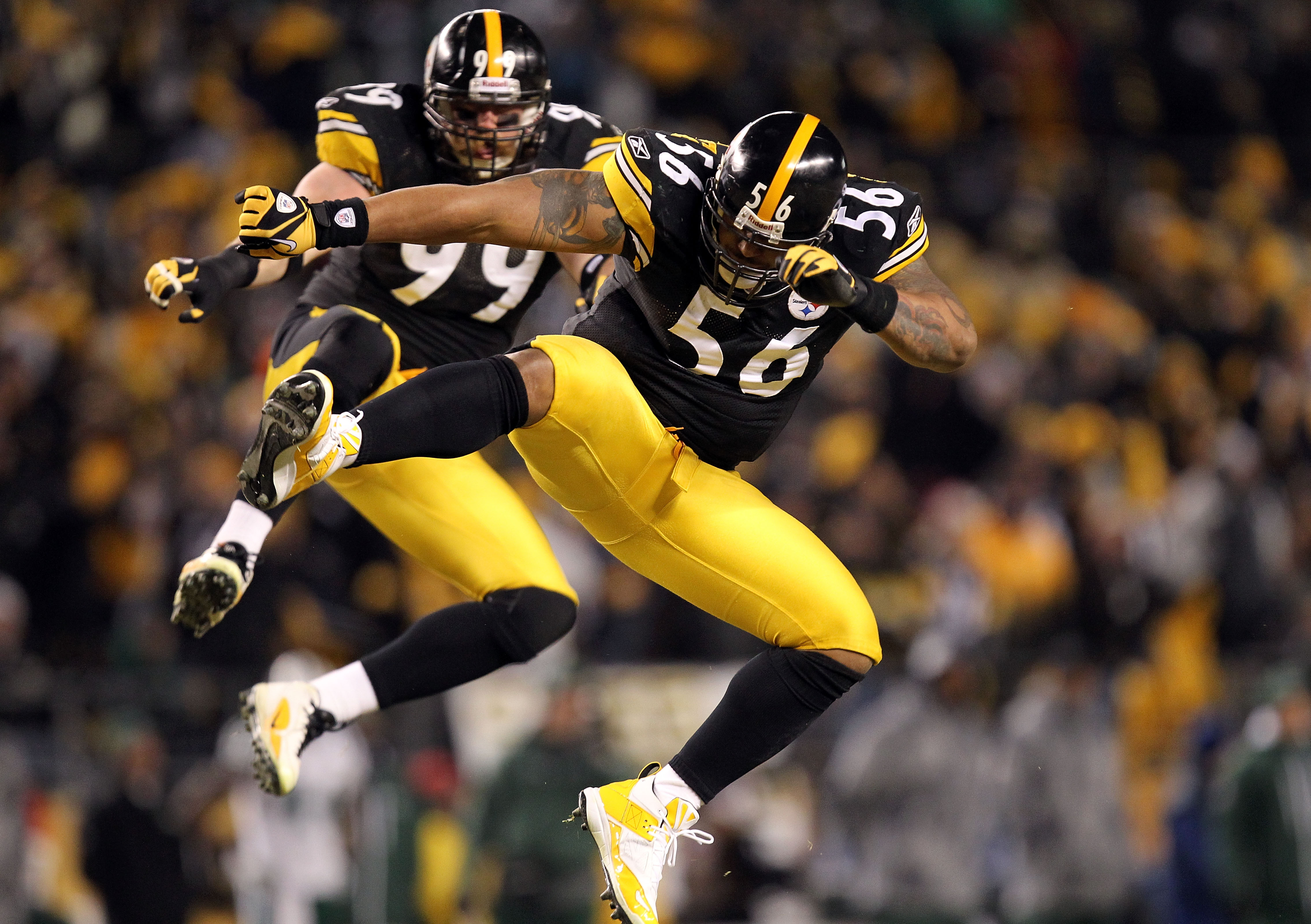 PITTSBURGH, PA - JANUARY 23:  LaMarr Woodley #56 and Brett Keisel #99 of the Pittsburgh Steelers celebrate after sacking Mark Sanchez #6 of the New York Jets during the 2011 AFC Championship game at Heinz Field on January 23, 2011 in Pittsburgh, Pennsylva