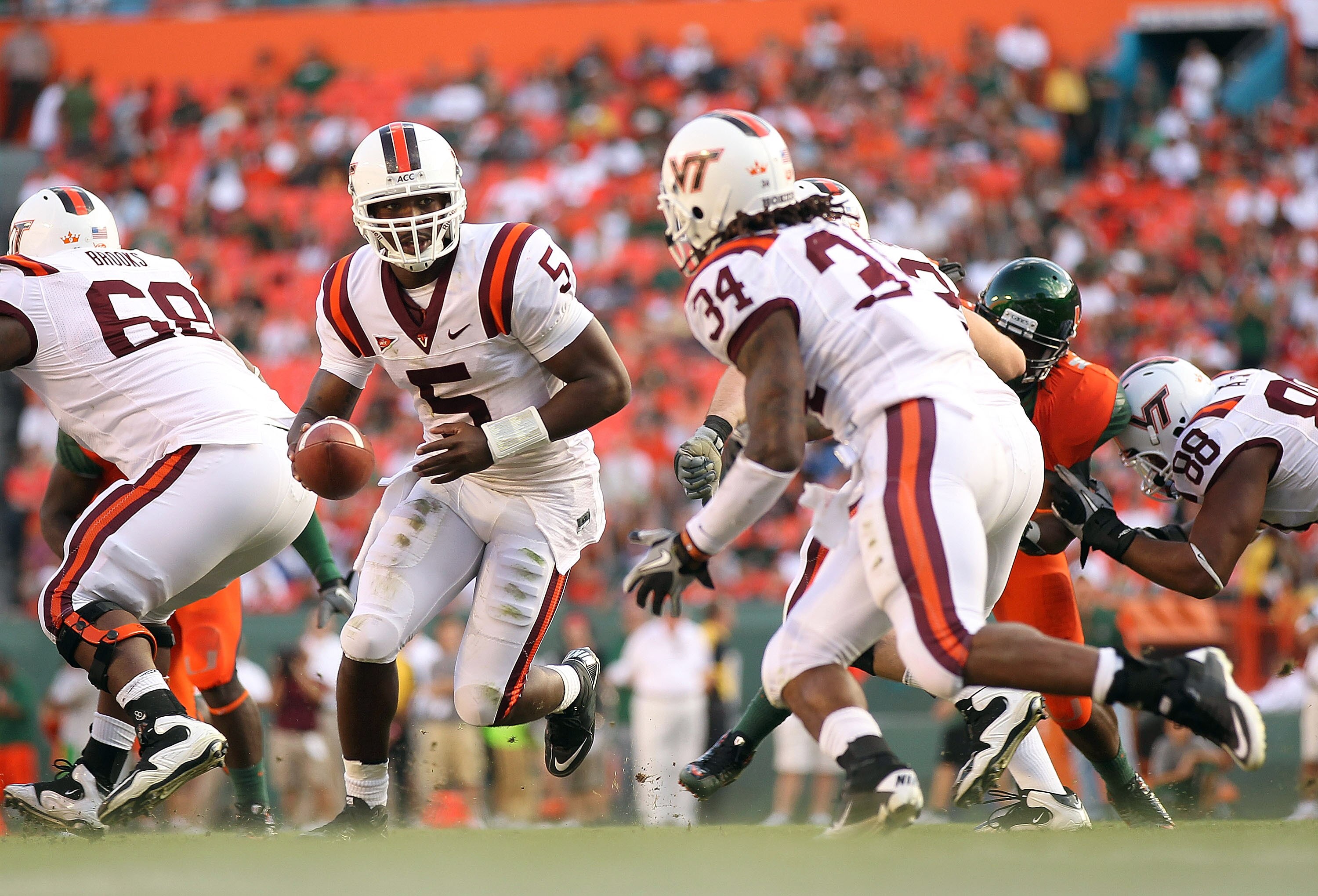 MIAMI - NOVEMBER 20:  Tyrod Taylor #5 of the Virginia Tech Hokies hands the ball off to teammate Ryan Williams #34 during a game against the Miami Hurricanes at Sun Life Stadium on November 20, 2010 in Miami, Florida.  (Photo by Mike Ehrmann/Getty Images)