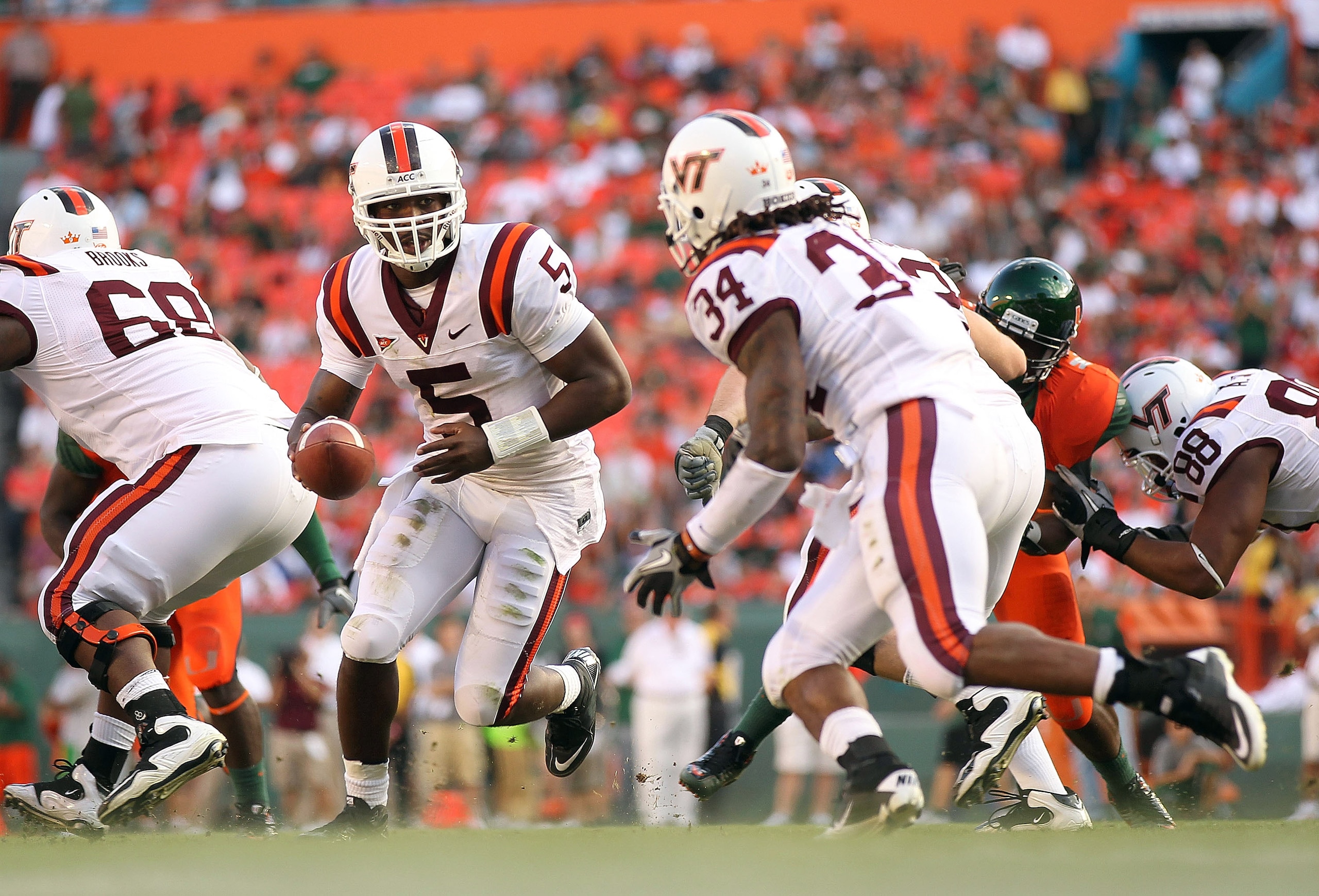 MIAMI - NOVEMBER 20: Tyrod Taylor #5 of the Virginia Tech Hokies hands the ball off to teammate Ryan Williams #34 during a game against the Miami Hurricanes at Sun Life Stadium on November 20, 2010 in Miami, Florida. (Photo by Mike Ehrmann/Getty Images) MIAMI - NOVEMBER 20: Tyrod Taylor #5 of the Virginia Tech Hokies hands the ball off to teammate Ryan Williams #34 during a game against the Miami Hurricanes at Sun Life Stadium on November 20, 2010 in Miami, Florida. (Photo by Mike Ehrmann/Getty Images)