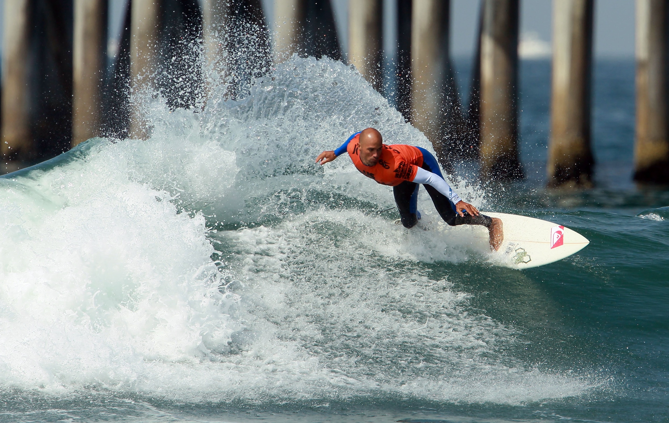 HUNTINGTON BEACH, CA - AUGUST 06: Kelly Slater performs a backside off the lip during the Hurley U.S. Open of Surfing on August 6, 2010 in Huntington Beach, California. (Photo by Jeff Gross/Getty Images) HUNTINGTON BEACH, CA - AUGUST 06: Kelly Slater performs a backside off the lip during the Hurley U.S. Open of Surfing on August 6, 2010 in Huntington Beach, California. (Photo by Jeff Gross/Getty Images)