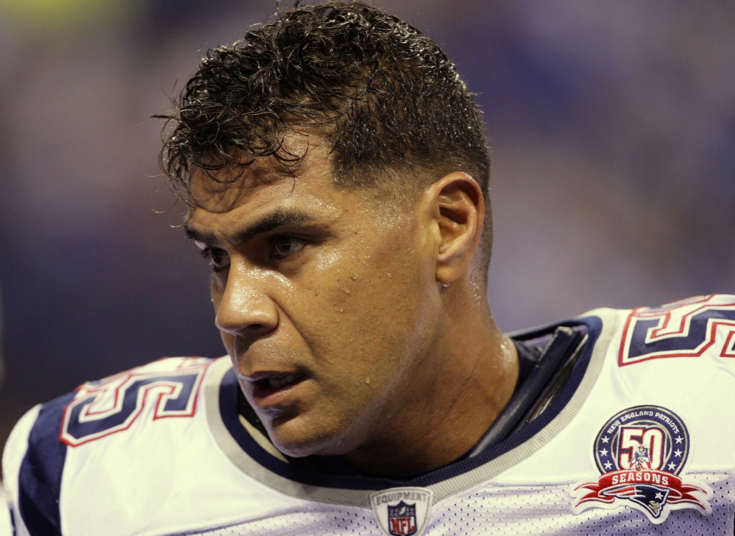 INDIANAPOLIS - NOVEMBER 15:  Junior Seau #55 of the New England Patriots looks on warm ups before the game against the Indianapolis Colts at Lucas Oil Stadium on November 15, 2009 in Indianapolis, Indiana.  (Photo by Jamie Squire/Getty Images)