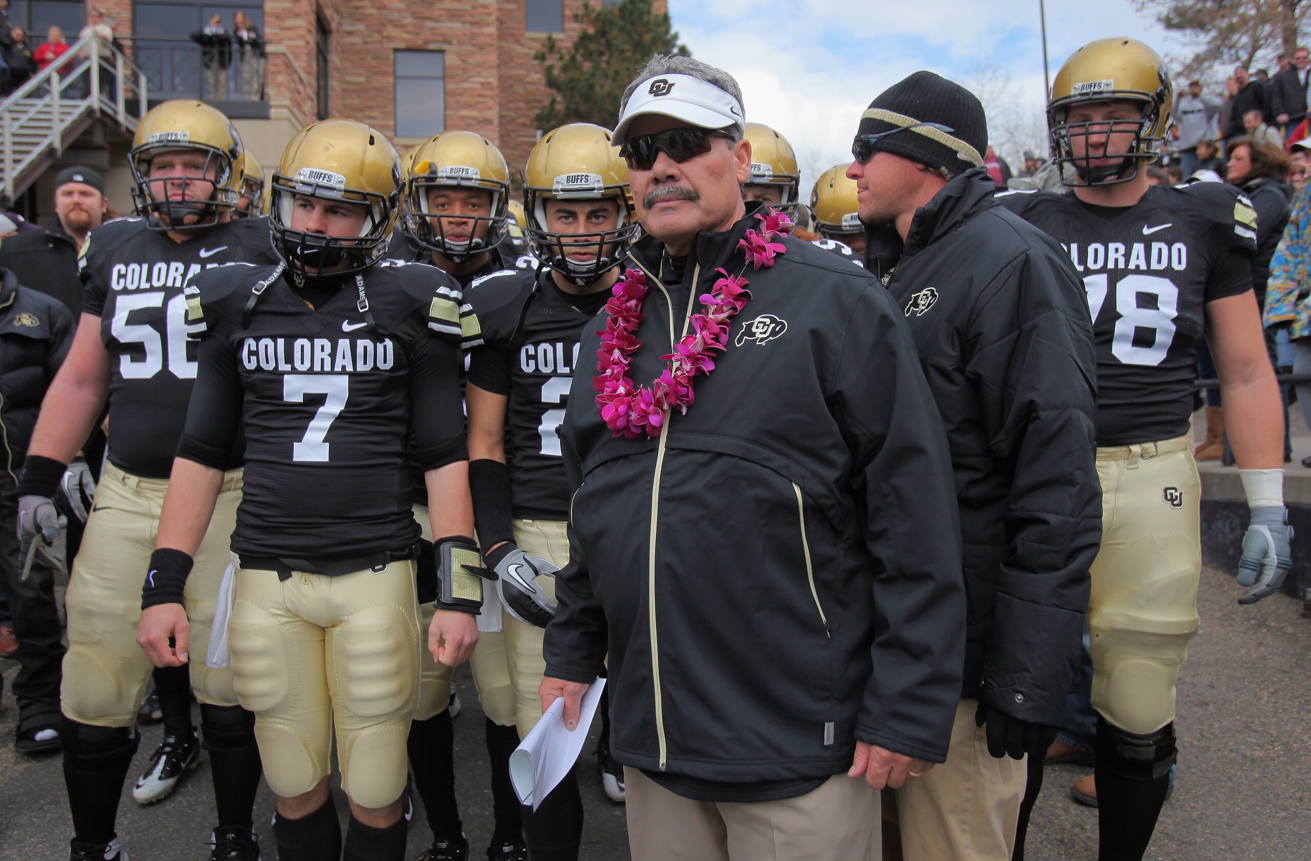 BOULDER, CO - NOVEMBER 13:  Interim head coach Brian Cabral prepares to lead Cody Hawkins #7 and the Colorado Buffaloes onto the field to face the Iowa State Cyclones at Folsom Field on November 13, 2010 in Boulder, Colorado. Cabral made his debut as inte
