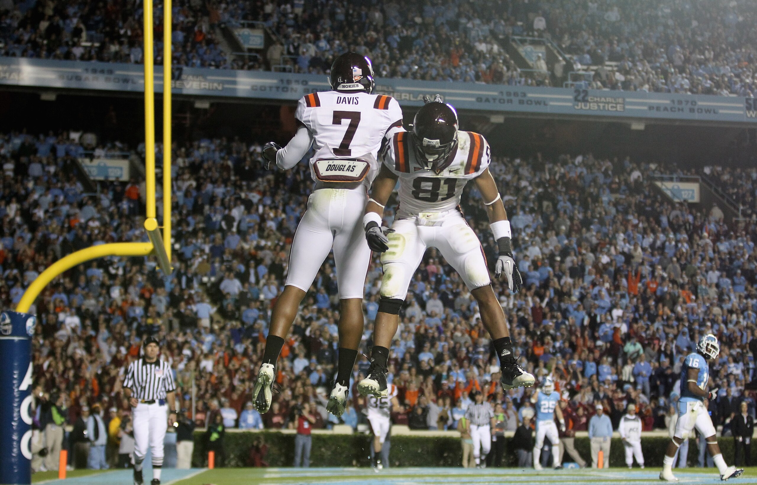 CHAPEL HILL, NC - NOVEMBER 13: Marcus Davis #7 of the Virginia Tech Hokies celebrates after scoring a touchdown with teammate Jarrett Boykin #81 against the North Carolina Tar Heels during their game at Kenan Stadium on November 13, 2010 in Chapel Hill, CHAPEL HILL, NC - NOVEMBER 13: Marcus Davis #7 of the Virginia Tech Hokies celebrates after scoring a touchdown with teammate Jarrett Boykin #81 against the North Carolina Tar Heels during their game at Kenan Stadium on November 13, 2010 in Chapel Hill,