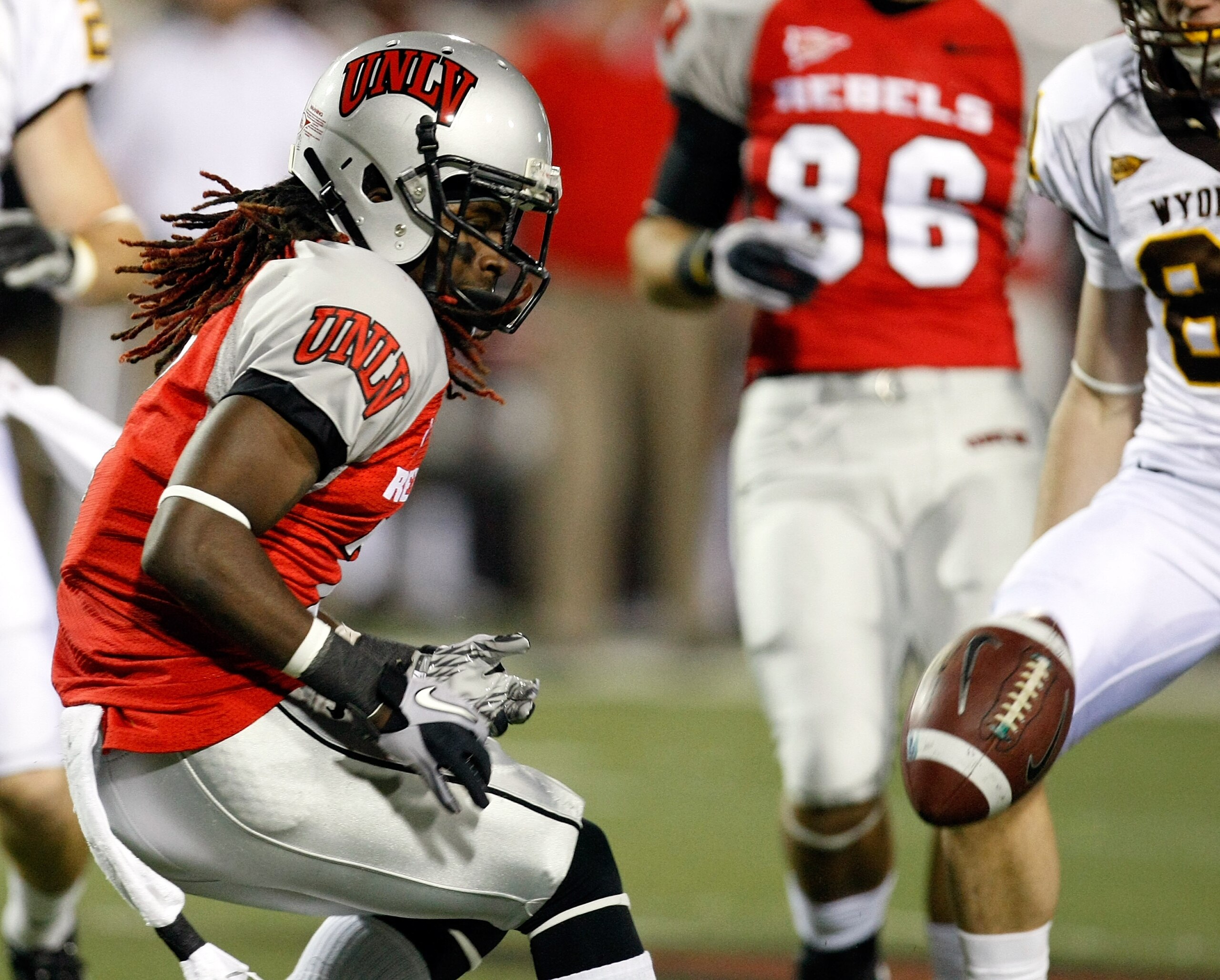 LAS VEGAS - NOVEMBER 13:  Michael Johnson #7 of the UNLV Rebels drops a punt during a game against the Wyoming Cowboys at Sam Boyd Stadium November 13, 2010 in Las Vegas, Nevada. UNLV won 42-16.  (Photo by Ethan Miller/Getty Images)
