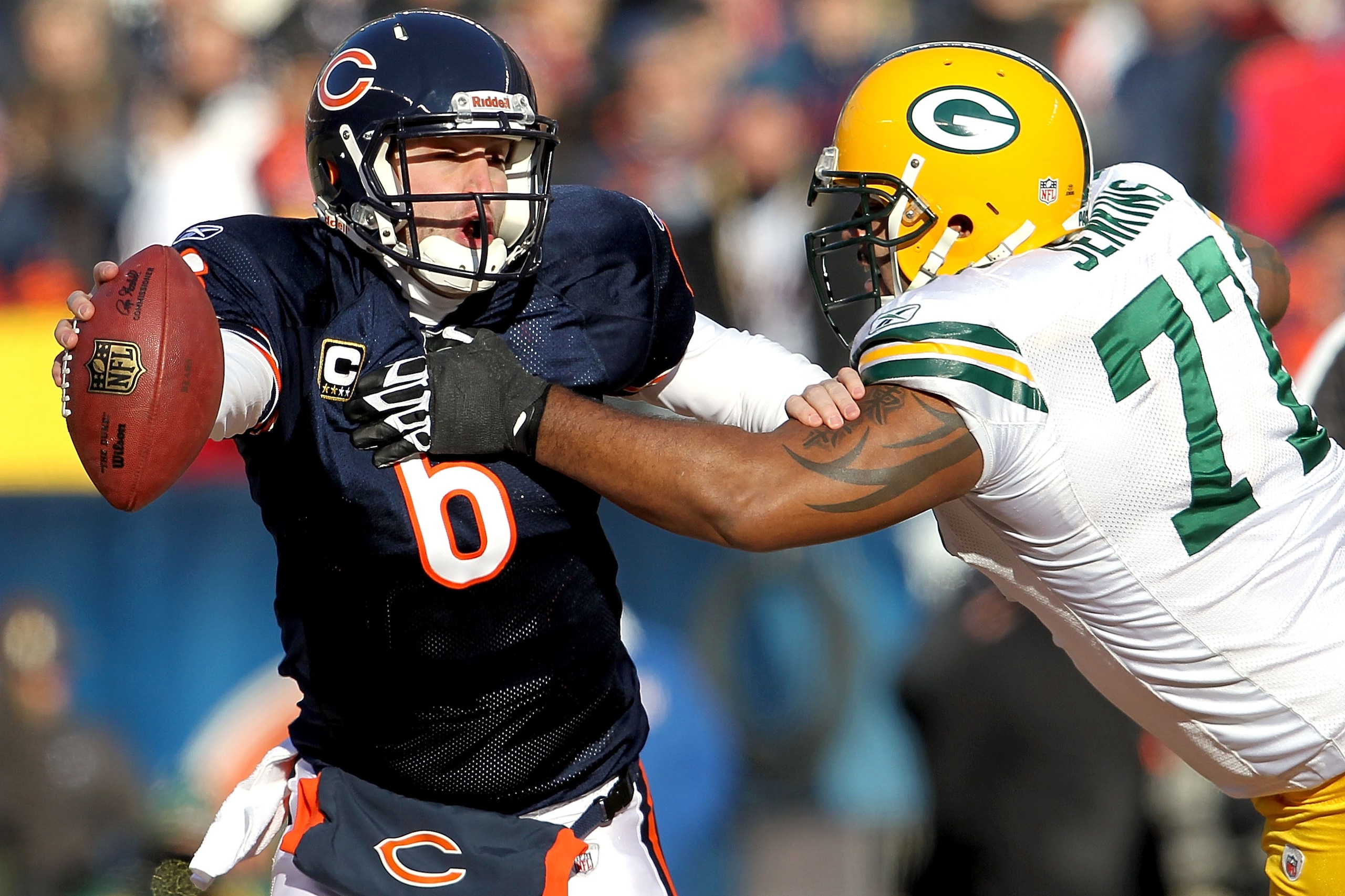 CHICAGO, IL - JANUARY 23: Quarterback Jay Cutler #6 of the Chicago Bears attempts to avoid a sack by Cullen Jenkins #77 of the Green Bay Packers in the first quarter of the NFC Championship Game at Soldier Field on January 23, 2011 in Chicago, Illinois. CHICAGO, IL - JANUARY 23: Quarterback Jay Cutler #6 of the Chicago Bears attempts to avoid a sack by Cullen Jenkins #77 of the Green Bay Packers in the first quarter of the NFC Championship Game at Soldier Field on January 23, 2011 in Chicago, Illinois.