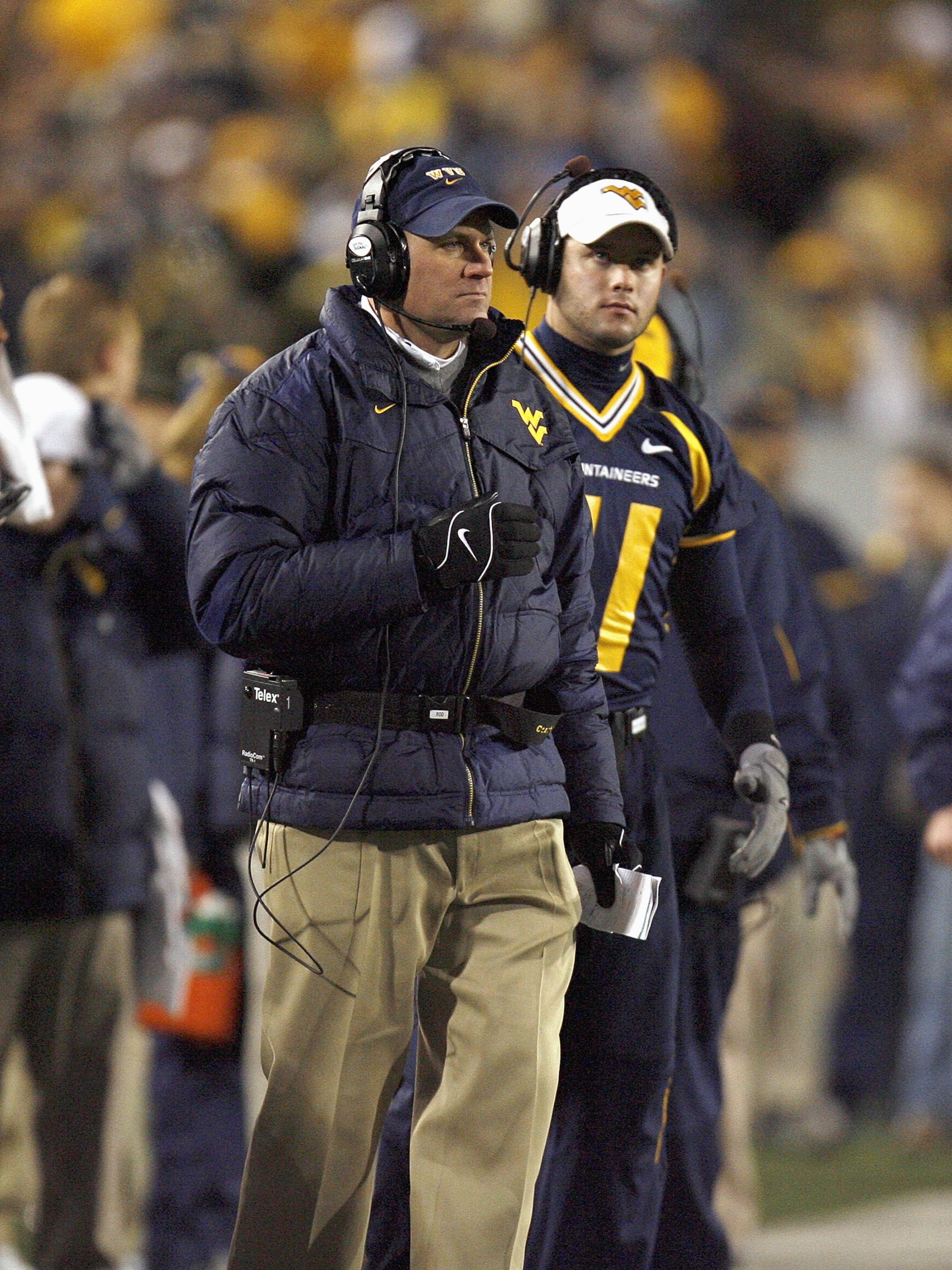 MORGANTOWN, WV - DECEMBER 2: Head coach Rich Rodriguez of the Virginia Mountaineers watches the action from the sidelines during the game against the Rutgers Scarlet Knights at Milan Puskar Stadium December 2, 2006 in Morgantown, West Virginia. Mountainee