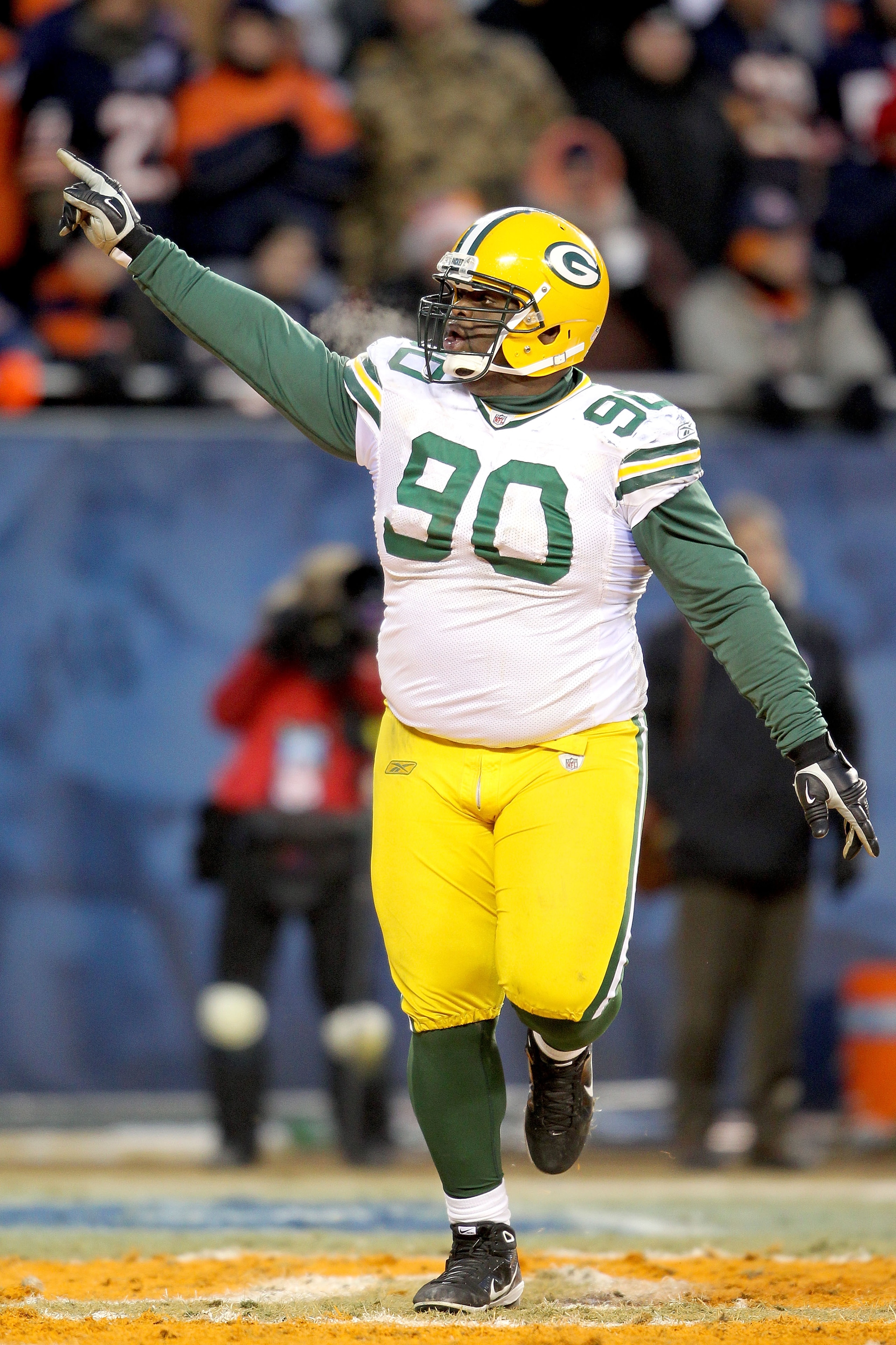 CHICAGO, IL - JANUARY 23: B.J. Raji #90 of the Green Bay Packers reacts after scoring on a 18-yard interception return for a touchdown in the fourth quarter against the Chicago Bears in the NFC Championship Game at Soldier Field on January 23, 2011 in Ch CHICAGO, IL - JANUARY 23: B.J. Raji #90 of the Green Bay Packers reacts after scoring on a 18-yard interception return for a touchdown in the fourth quarter against the Chicago Bears in the NFC Championship Game at Soldier Field on January 23, 2011 in Ch