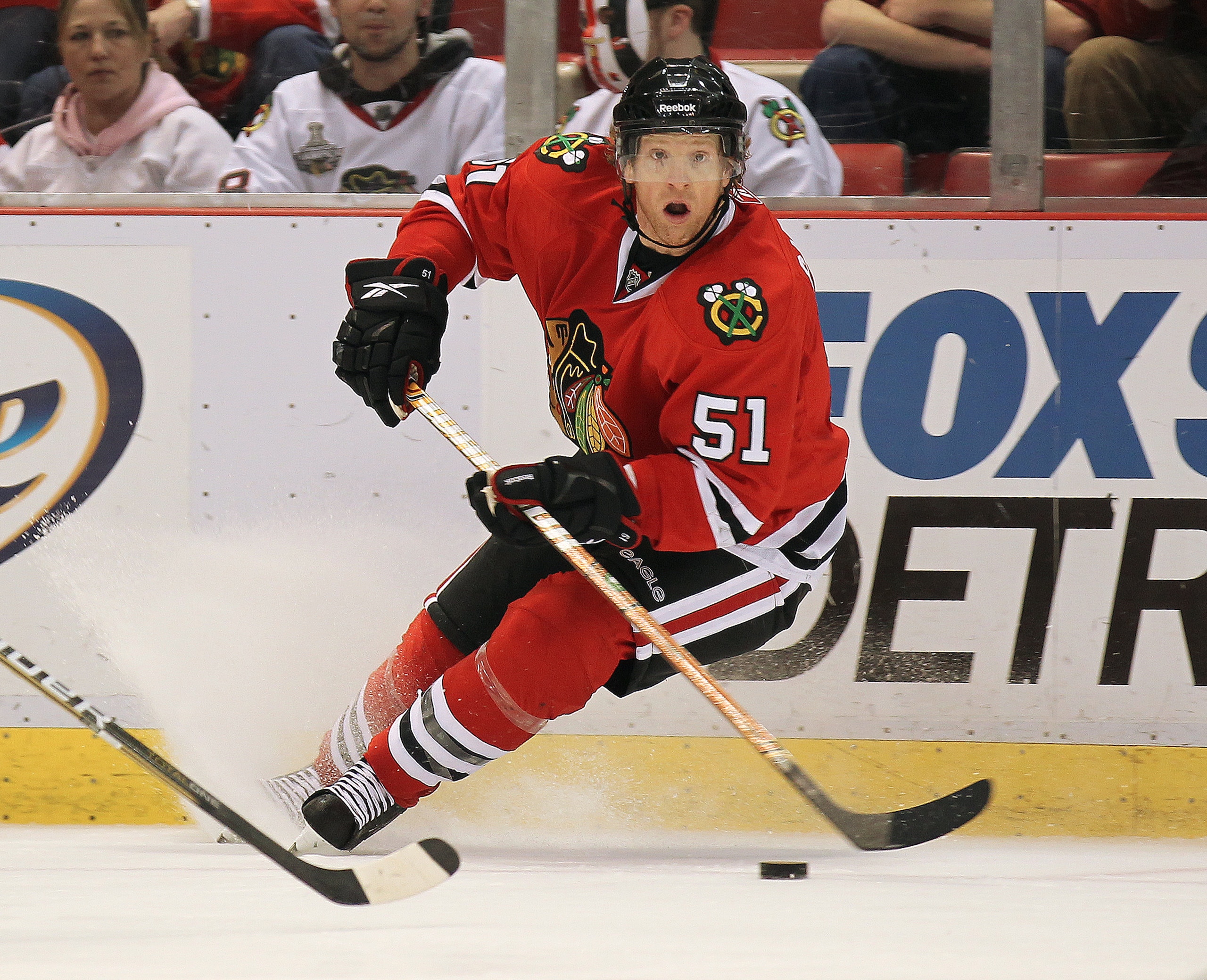 DETROIT, MI - JANUARY 22:  Brian Campbell #51 of the Chicago Black Hawks turns with the puck in a game against the Detroit Red Wings on January 22, 2011 at the Joe Louis Arena in Detroit, Michigan. The Hawks defeated the Wings 4-1. (Photo by Claus Anderse