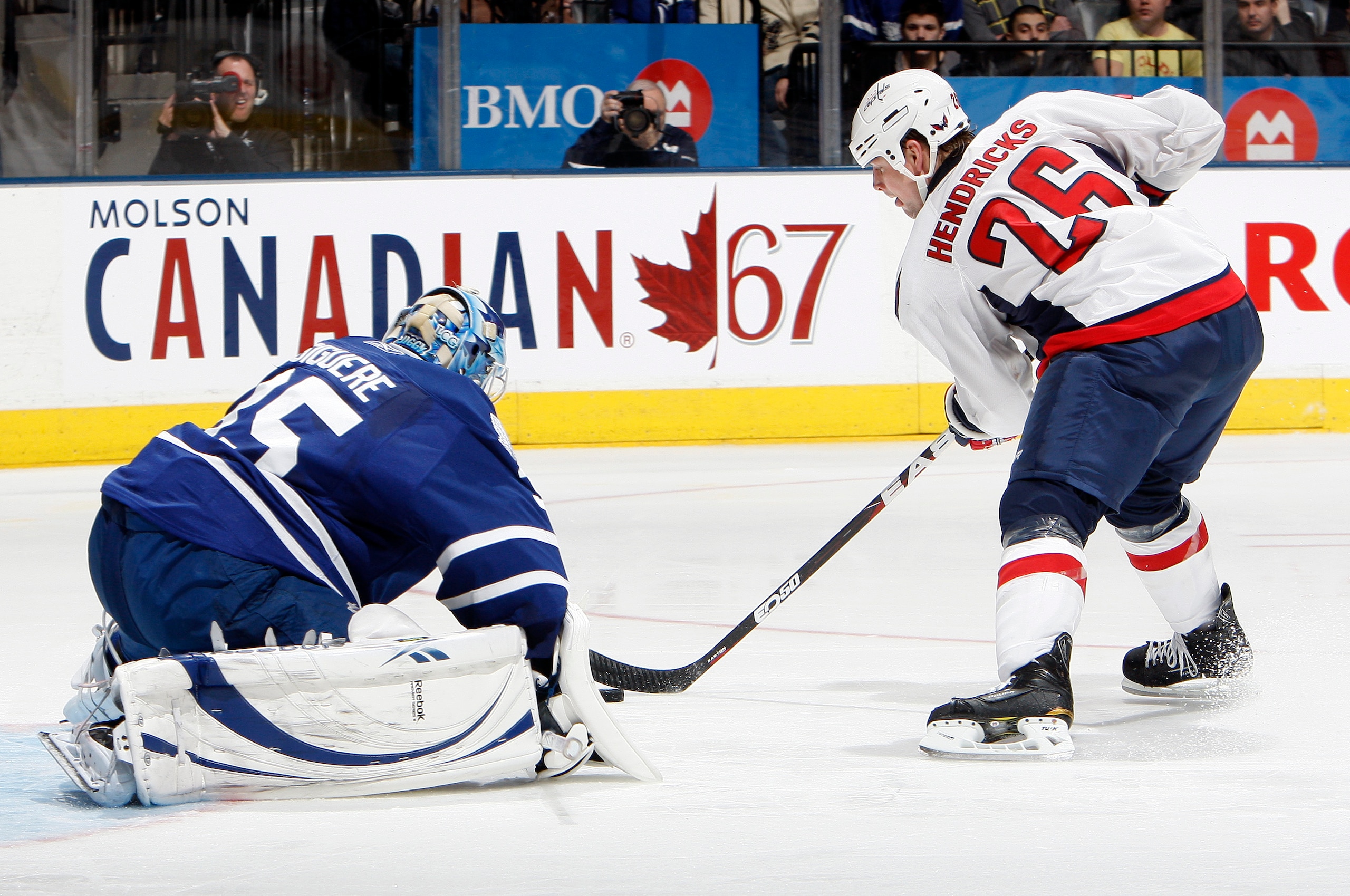 TORONTO, CANADA - JANUARY 22: Jean-Sebastien Giguere #35 of the Toronto Maple Leafs gets scored on by Matt Hendricks #26 of the Washington Capitals during game action at the Air Canada Centre January 22, 2011 in Toronto, Ontario, Canada. (Photo by Abelima
