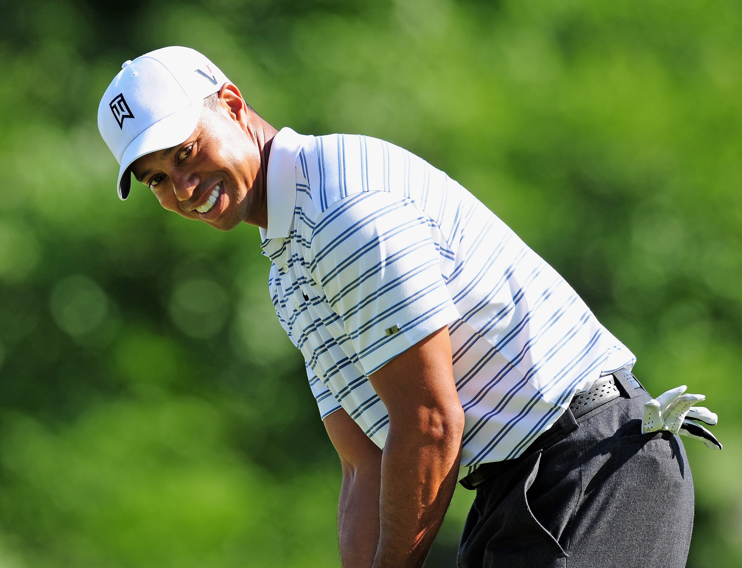 AKRON, OH - AUGUST 05:  Tiger Woods of USA looks happy during a practice round of the World Golf Championship Bridgestone Invitational on August 5, 2009 at Firestone Country Club in Akron, Ohio.  (Photo by Stuart Franklin/Getty Images)