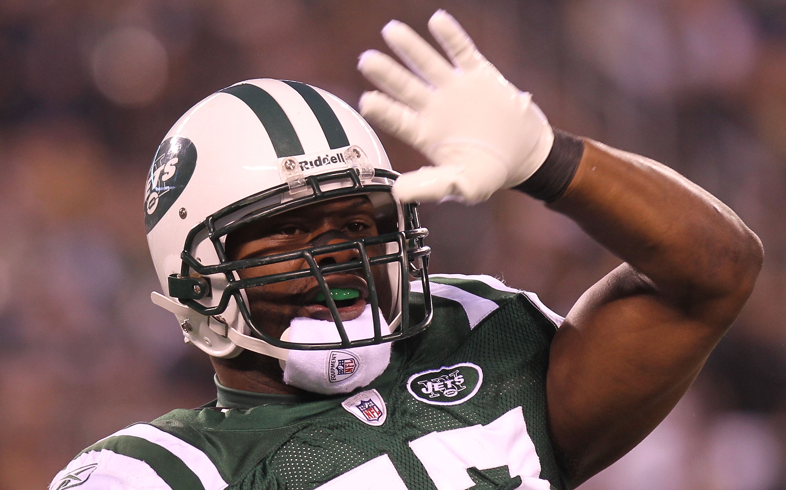 EAST RUTHERFORD, NJ - DECEMBER 12:  Bart Scott #57 of the New York Jets reacts the Miami Dolphins at New Meadowlands Stadium on December 12, 2010 in East Rutherford, New Jersey.  (Photo by Nick Laham/Getty Images)