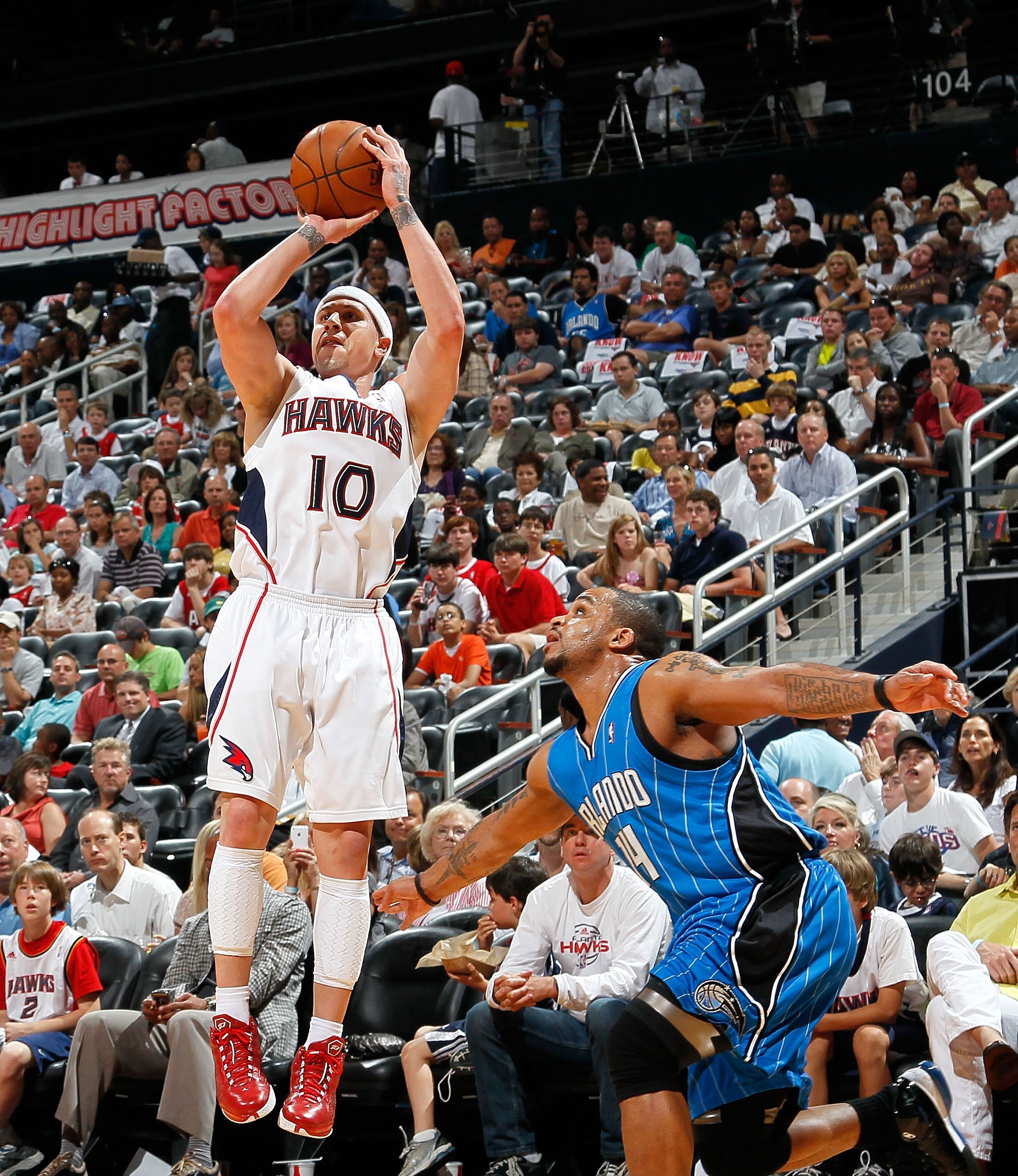 ATLANTA - MAY 08:  Jameer Nelson #14 of the Orlando Magic and Mike Bibby #10 of the Atlanta Hawks during Game Three of the Eastern Conference Semifinals during the 2010 NBA Playoffs at Philips Arena on May 8, 2010 in Atlanta, Georgia.  NOTE TO USER: User