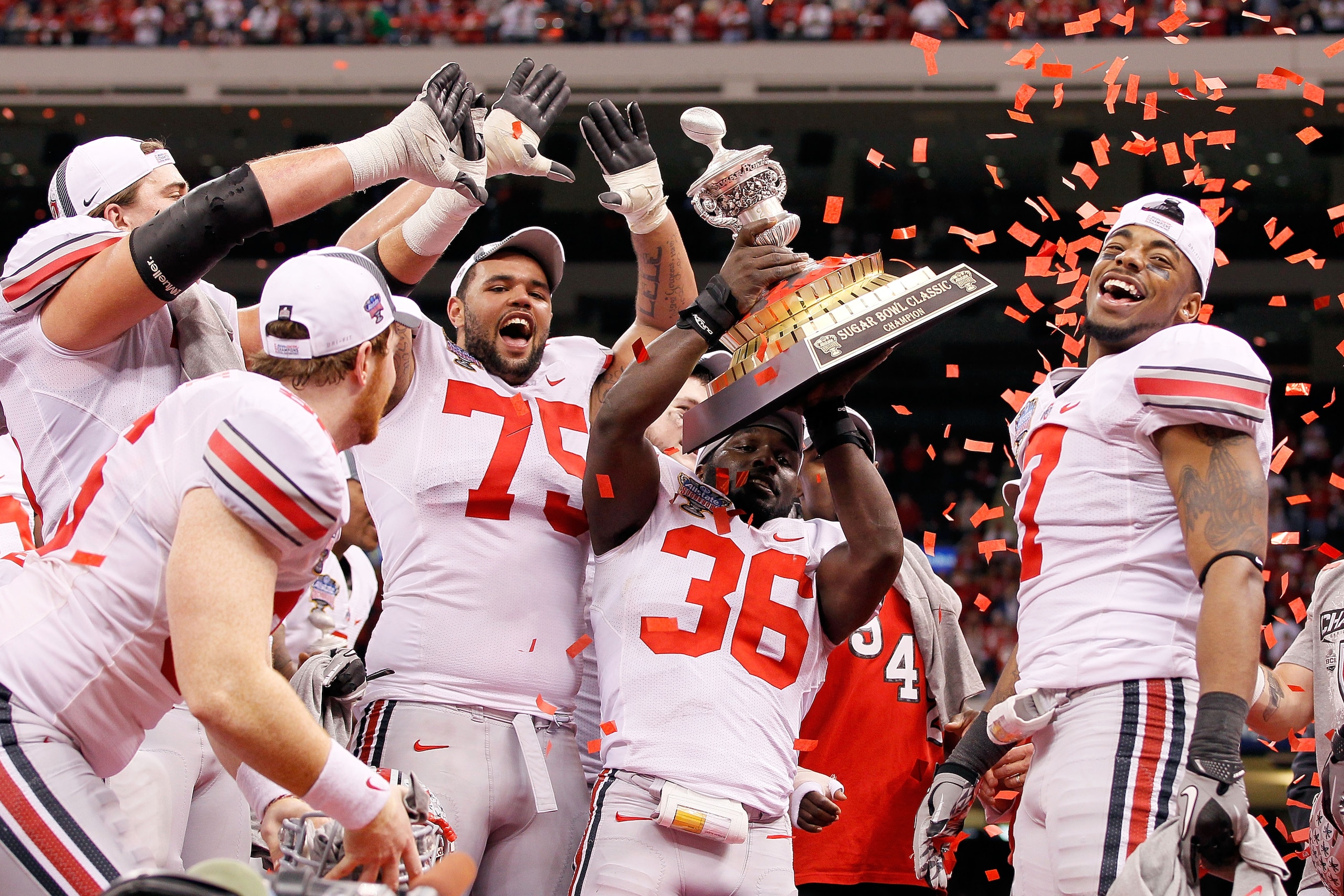NEW ORLEANS, LA - JANUARY 04:  Brian Rolle #36 of the Ohio State Buckeyes holds the trophy as the Buckeyes celebrate their 31-26 victory against the Arkansas Razorbacks during the Allstate Sugar Bowl at the Louisiana Superdome on January 4, 2011 in New Or