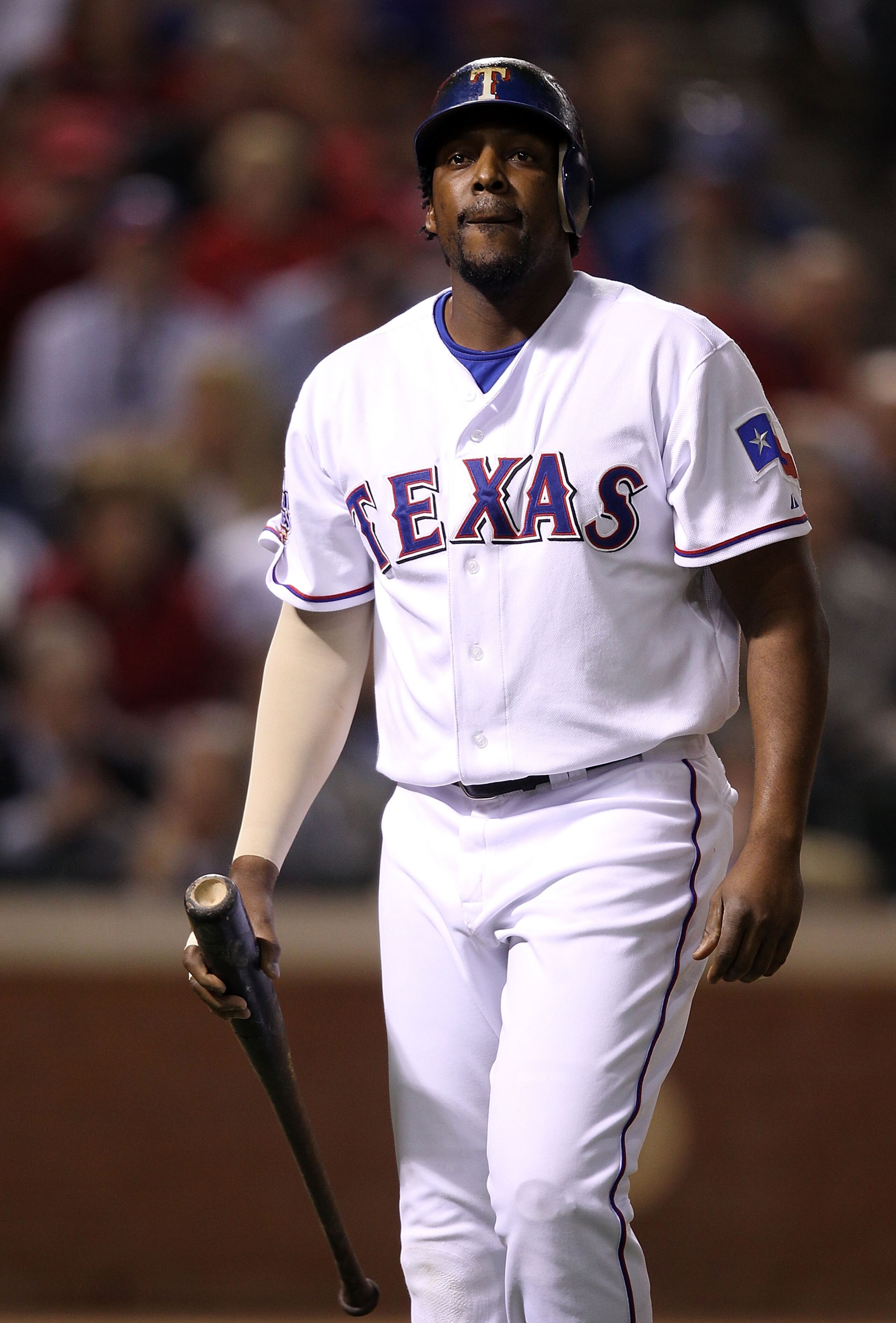 ARLINGTON, TX - OCTOBER 31:  Vladimir Guerrero #27 of the Texas Rangers reacts as he walks back to the dugout after he struck out in the fourth inning against the San Francisco Giants in Game Four of the 2010 MLB World Series at Rangers Ballpark in Arling