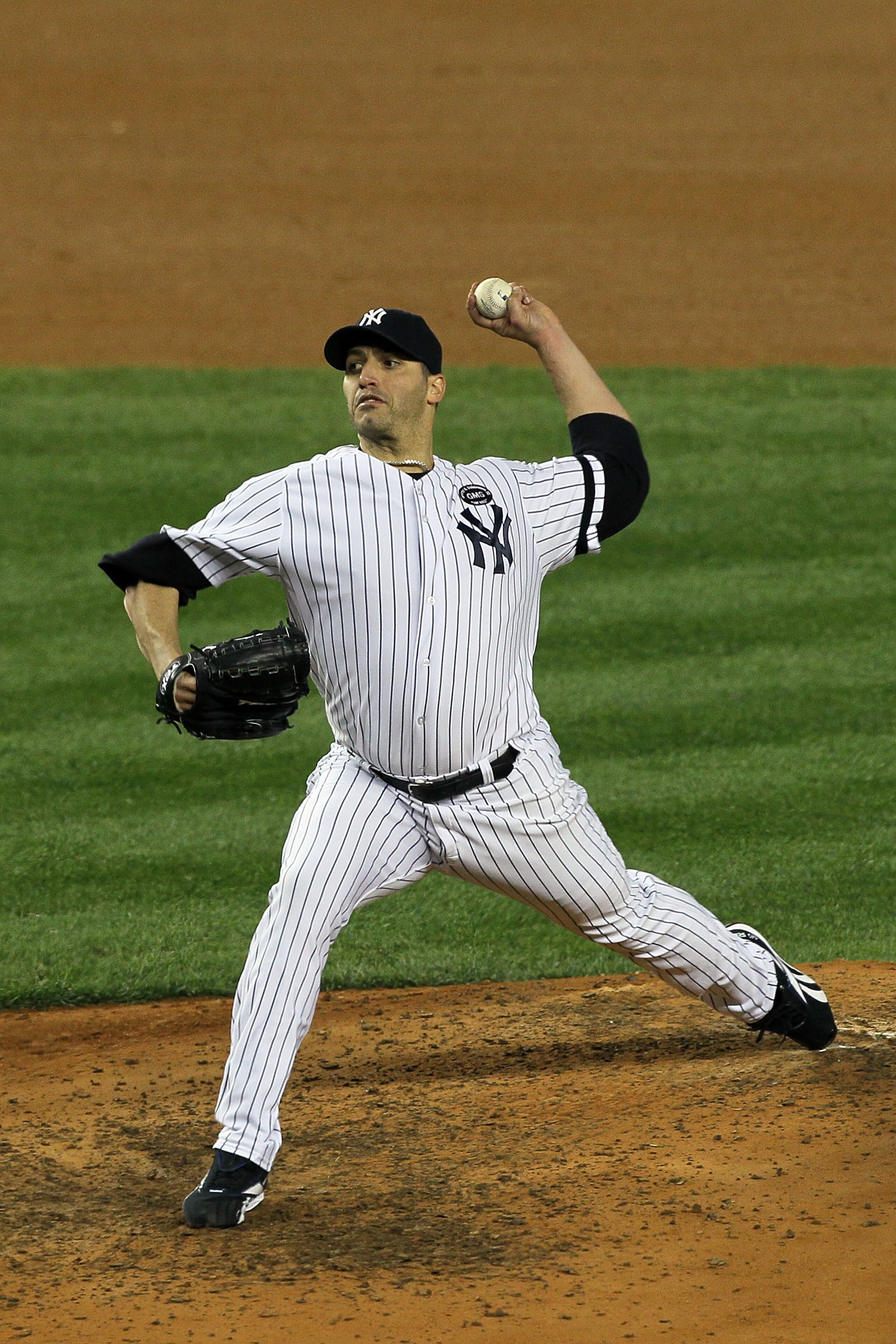 NEW YORK - OCTOBER 18:  Starting pitcher Andy Pettitte #46 of the New York Yankees pitches against the Texas Rangers in Game Three of the ALCS during the 2010 MLB Playoffs at Yankee Stadium on October 18, 2010 in New York, New York. The Raners won 8-0.  (