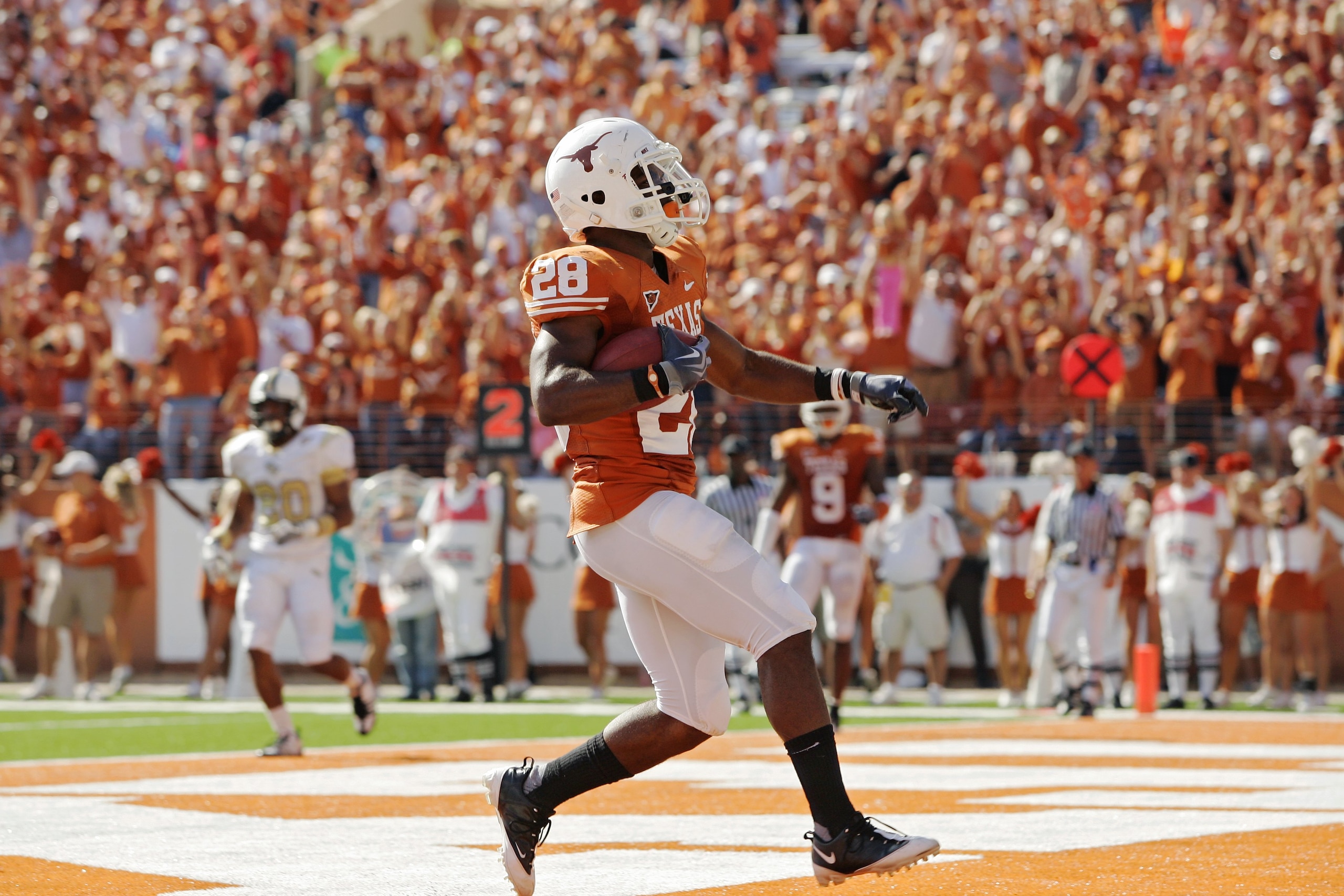 AUSTIN, TX - NOVEMBER 07: Running back Fozzy Whittaker #28 of the Texas Longhorns scores a touchdown against the UCF Knights in the third quarter on November 7, 2009 at Darrell K Royal - Texas Memorial Stadium in Austin, Texas. Texas won 35-3. (Photo b AUSTIN, TX - NOVEMBER 07: Running back Fozzy Whittaker #28 of the Texas Longhorns scores a touchdown against the UCF Knights in the third quarter on November 7, 2009 at Darrell K Royal - Texas Memorial Stadium in Austin, Texas. Texas won 35-3. (Photo b