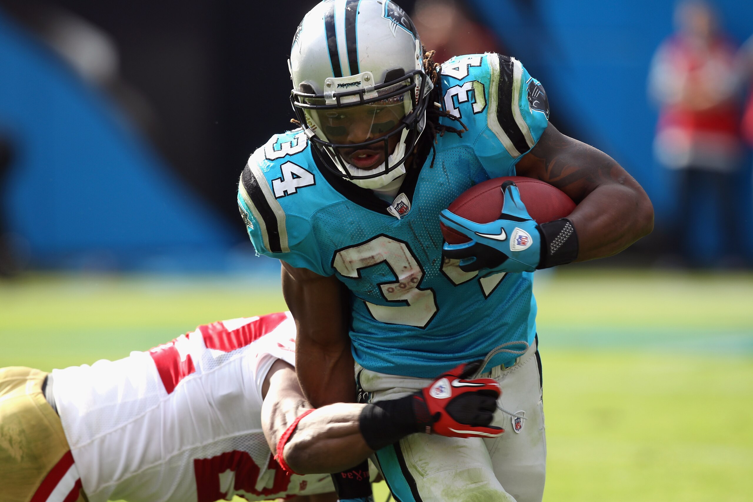 CHARLOTTE, NC - OCTOBER 24: DeAngelo Williams #34 of the Carolina Panthers runs with the ball against the San Francisco 49ers during their game at Bank of America Stadium on October 24, 2010 in Charlotte, North Carolina. (Photo by Streeter Lecka/Getty I CHARLOTTE, NC - OCTOBER 24: DeAngelo Williams #34 of the Carolina Panthers runs with the ball against the San Francisco 49ers during their game at Bank of America Stadium on October 24, 2010 in Charlotte, North Carolina. (Photo by Streeter Lecka/Getty I