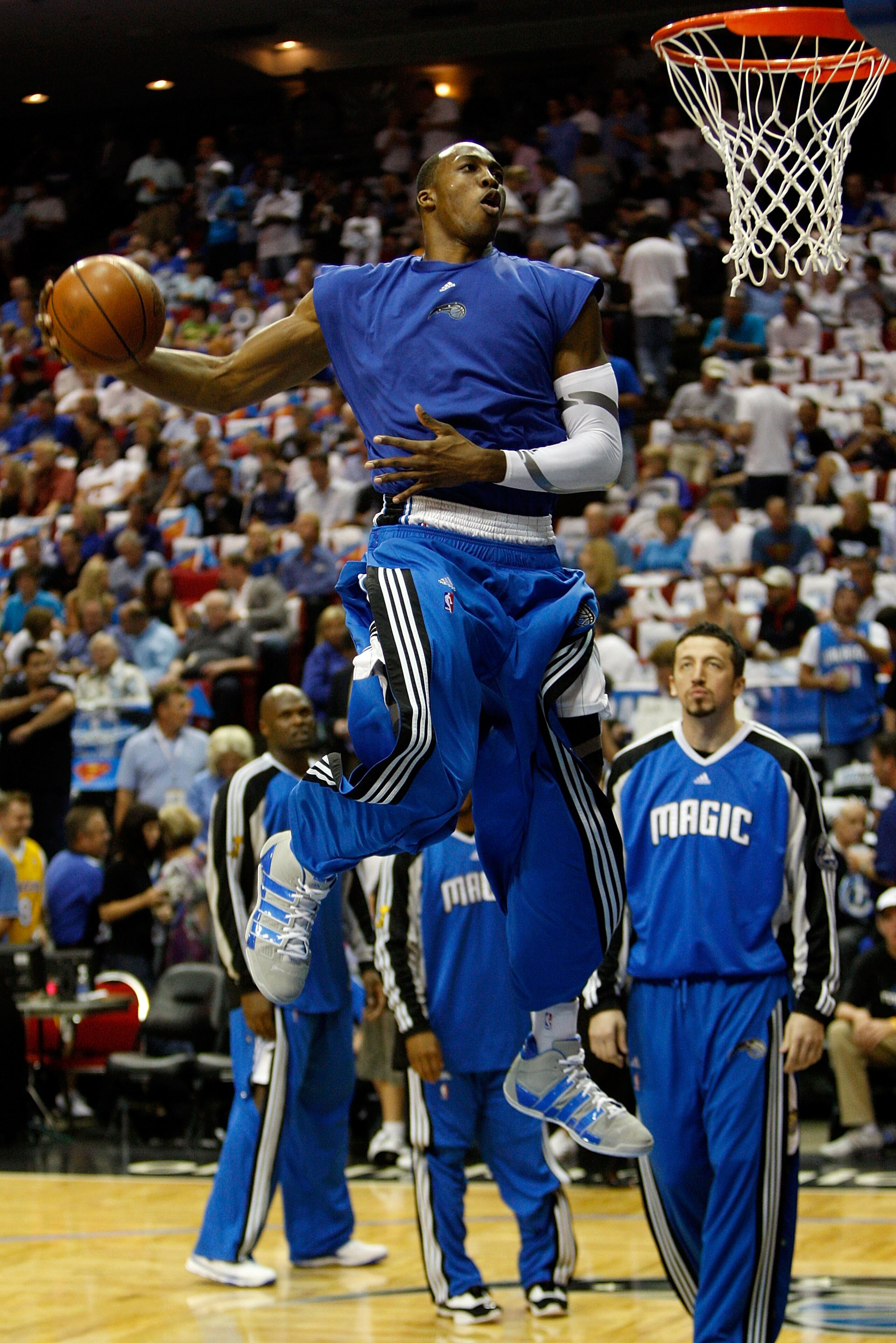 ORLANDO, FL - JUNE 11:  Dwight Howard #12 of the Orlando Magic goes to the basket for a slam dunk before Game Four of the 2009 NBA Finals against the Los Angeles Lakers on June 11, 2009 at Amway Arena in Orlando, Florida.  NOTE TO USER:  User expressly ac