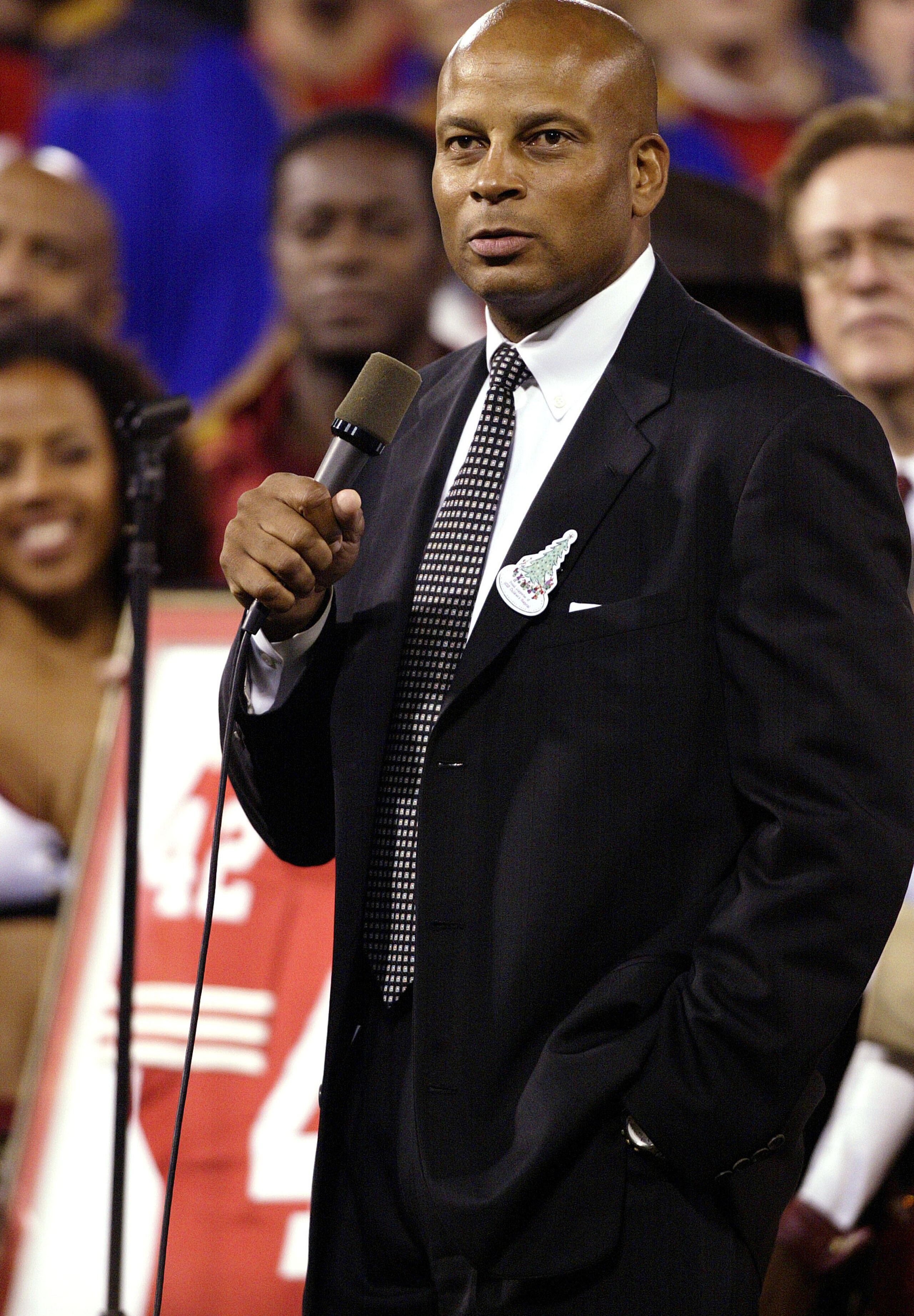 SAN FRANCISCO - NOVEMBER 17:  Former San Francisco 49er Ronnie Lott speaks to the crowd as he has his #42 jersey retired during a halftime ceremony during the Pittsburgh Steelers v San Francisco 49ers game on November 17, 2003 at Candlestick Park in San F
