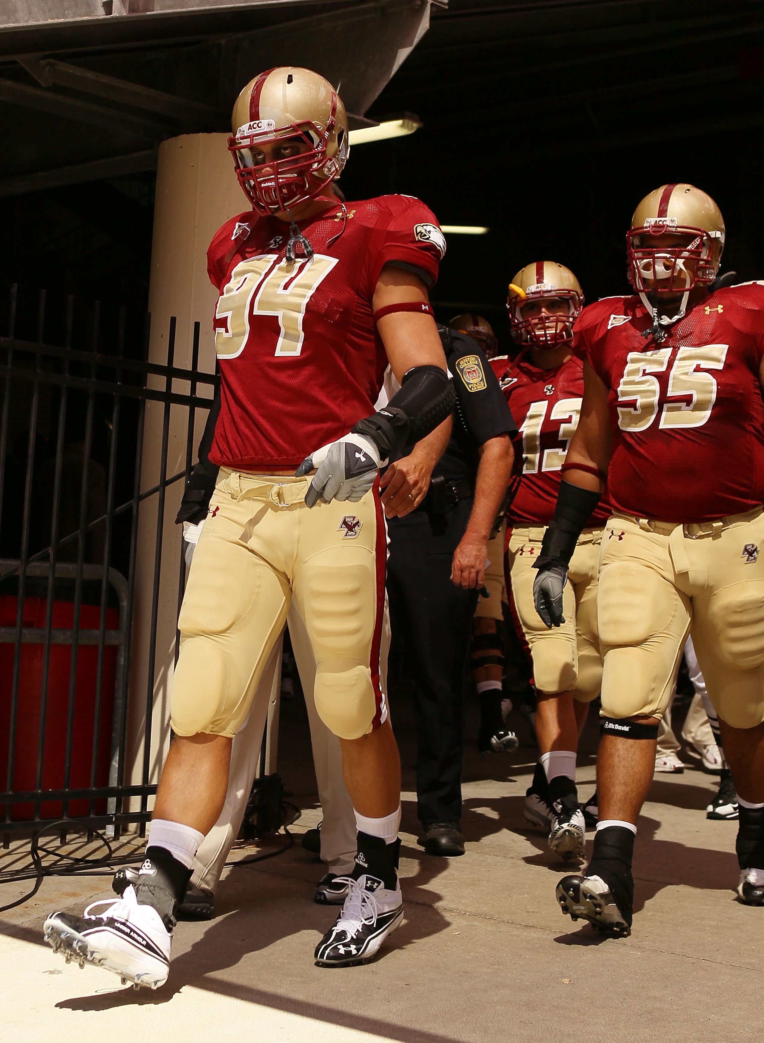 CHESTNUT HILL, MA - SEPTEMBER 04: Mark Herzlich #94, Damik Scafe #55 and Codi Boek #13 of the Boston College Eagles walk out to the field for the home opening game against the Weber State Wildcats on September 4, 2010 at Alumni Stadium in Chestnut Hill, CHESTNUT HILL, MA - SEPTEMBER 04: Mark Herzlich #94, Damik Scafe #55 and Codi Boek #13 of the Boston College Eagles walk out to the field for the home opening game against the Weber State Wildcats on September 4, 2010 at Alumni Stadium in Chestnut Hill,
