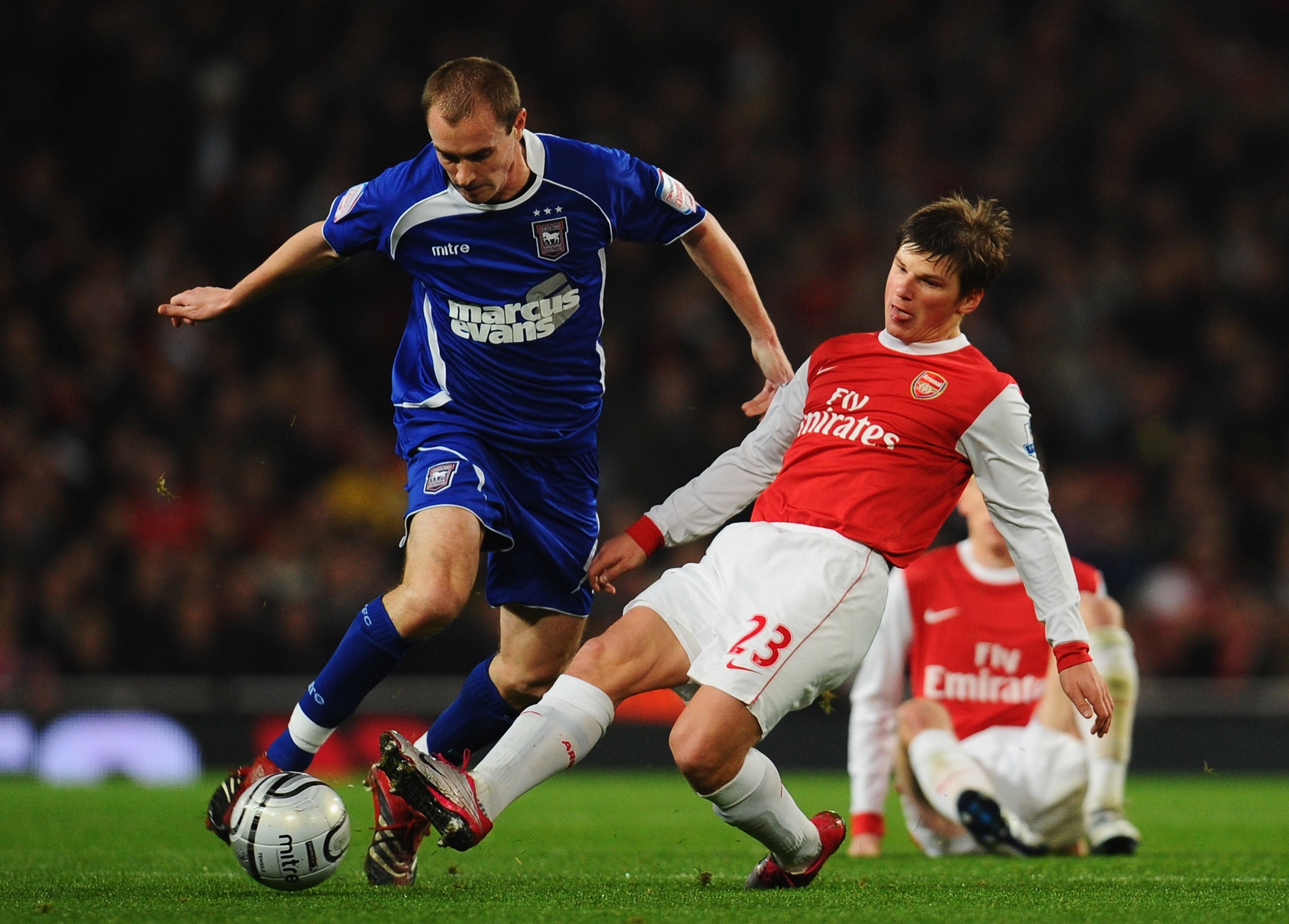 LONDON, ENGLAND - JANUARY 25: Andrey Arshavin of Arsenal tackles Colin Healy of Ipswich Town during the Carling Cup Semi Final Second Leg match between Arsenal and Ipswich Town at Emirates Stadium on January 25, 2011 in London, England. (Photo by Clive LONDON, ENGLAND - JANUARY 25: Andrey Arshavin of Arsenal tackles Colin Healy of Ipswich Town during the Carling Cup Semi Final Second Leg match between Arsenal and Ipswich Town at Emirates Stadium on January 25, 2011 in London, England. (Photo by Clive