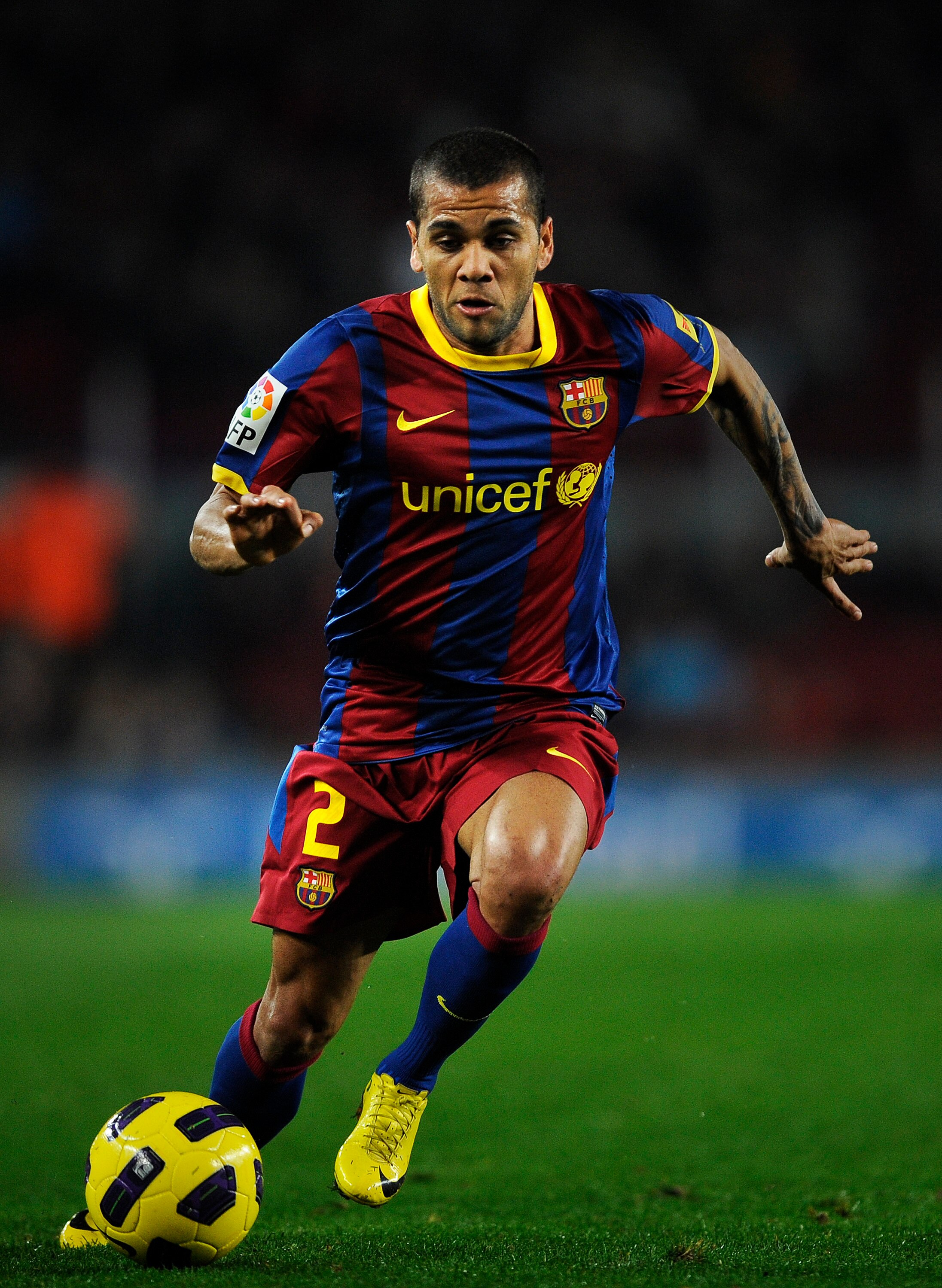 BARCELONA, SPAIN - JANUARY 12:  Dani Alves of FC Barcelona runs with the ball during the Copa del Rey quarter final first leg match between FC Barcelona and Betis at Camp Nou on January 12, 2011 in Barcelona, Spain. Barcelona won 5-0.  (Photo by David Ram