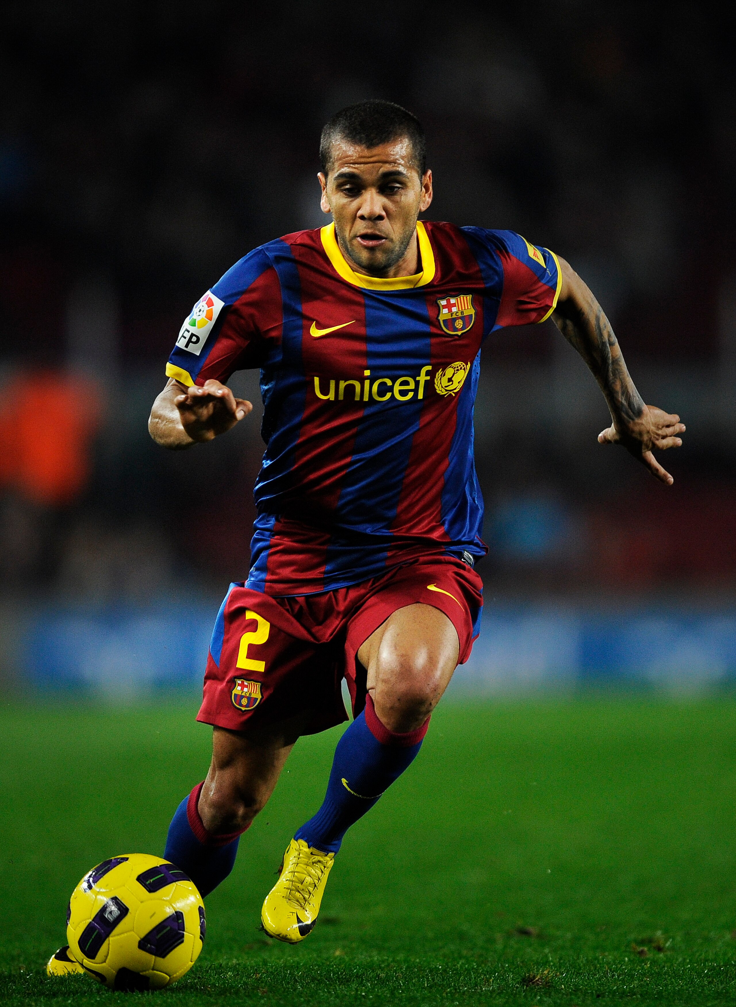 BARCELONA, SPAIN - JANUARY 12: Dani Alves of FC Barcelona runs with the ball during the Copa del Rey quarter final first leg match between FC Barcelona and Betis at Camp Nou on January 12, 2011 in Barcelona, Spain. Barcelona won 5-0. (Photo by David Ram BARCELONA, SPAIN - JANUARY 12: Dani Alves of FC Barcelona runs with the ball during the Copa del Rey quarter final first leg match between FC Barcelona and Betis at Camp Nou on January 12, 2011 in Barcelona, Spain. Barcelona won 5-0. (Photo by David Ram