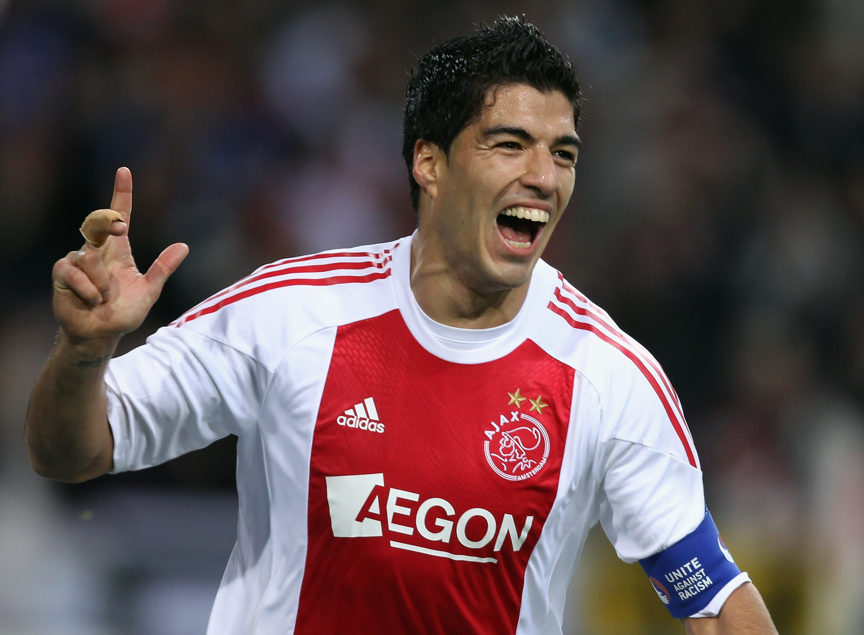 AMSTERDAM, NETHERLANDS - OCTOBER 19:  Luis Suarez of AFC Ajax celebrates scoring during the UEFA Champions League Group G match between AFC Ajax and AJ Auxerre at the Amsterdam ArenA on October 19, 2010 in Amsterdam, Netherlands.  (Photo by Bryn Lennon/Ge