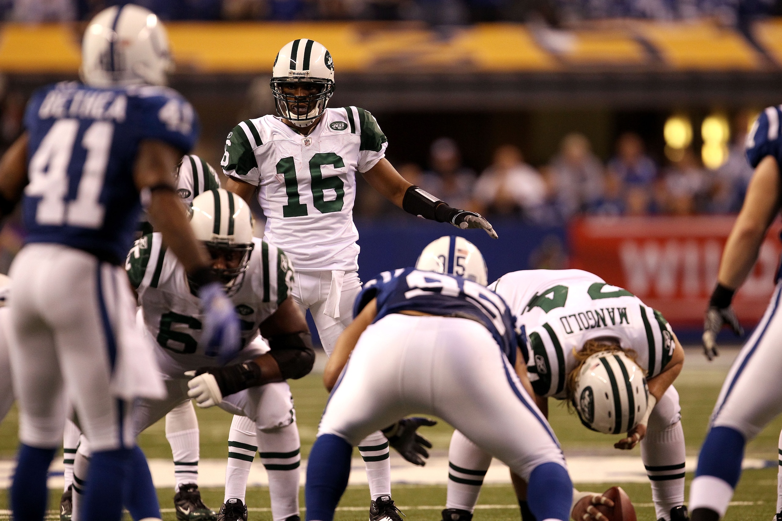 INDIANAPOLIS, IN - JANUARY 08:  Brad Smith #16 of the New York Jets lines up in the wildcat formation at quarterback against the Indianapolis Colts during their 2011 AFC wild card playoff game at Lucas Oil Stadium on January 8, 2011 in Indianapolis, India