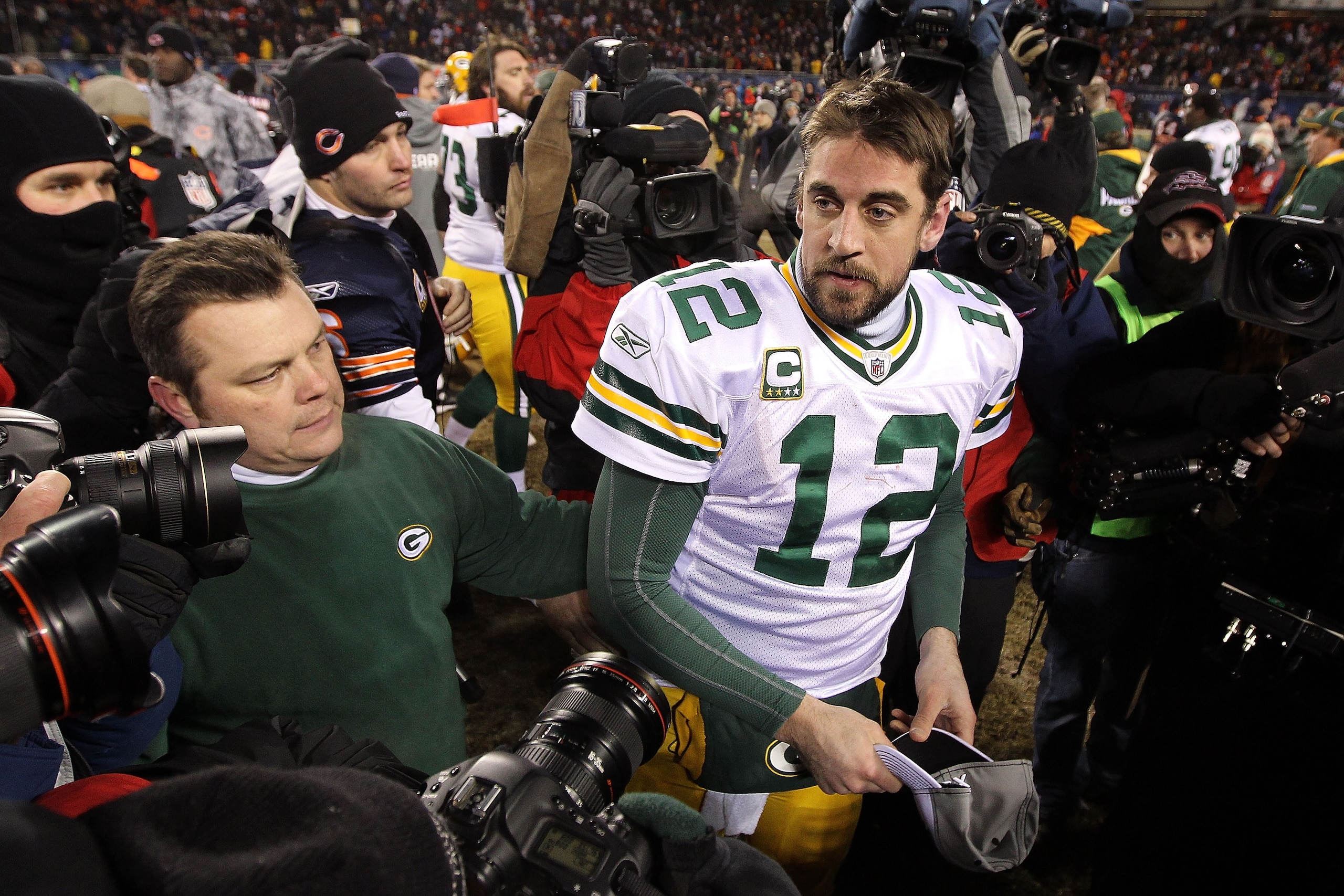 CHICAGO, IL - JANUARY 23:  Quarterback Aaron Rodgers #12 of the Green Bay Packers stands by Jay Cutler #6 of the Chicago Bears after the Packers 21-14 victory against the Bears in the NFC Championship Game at Soldier Field on January 23, 2011 in Chicago,