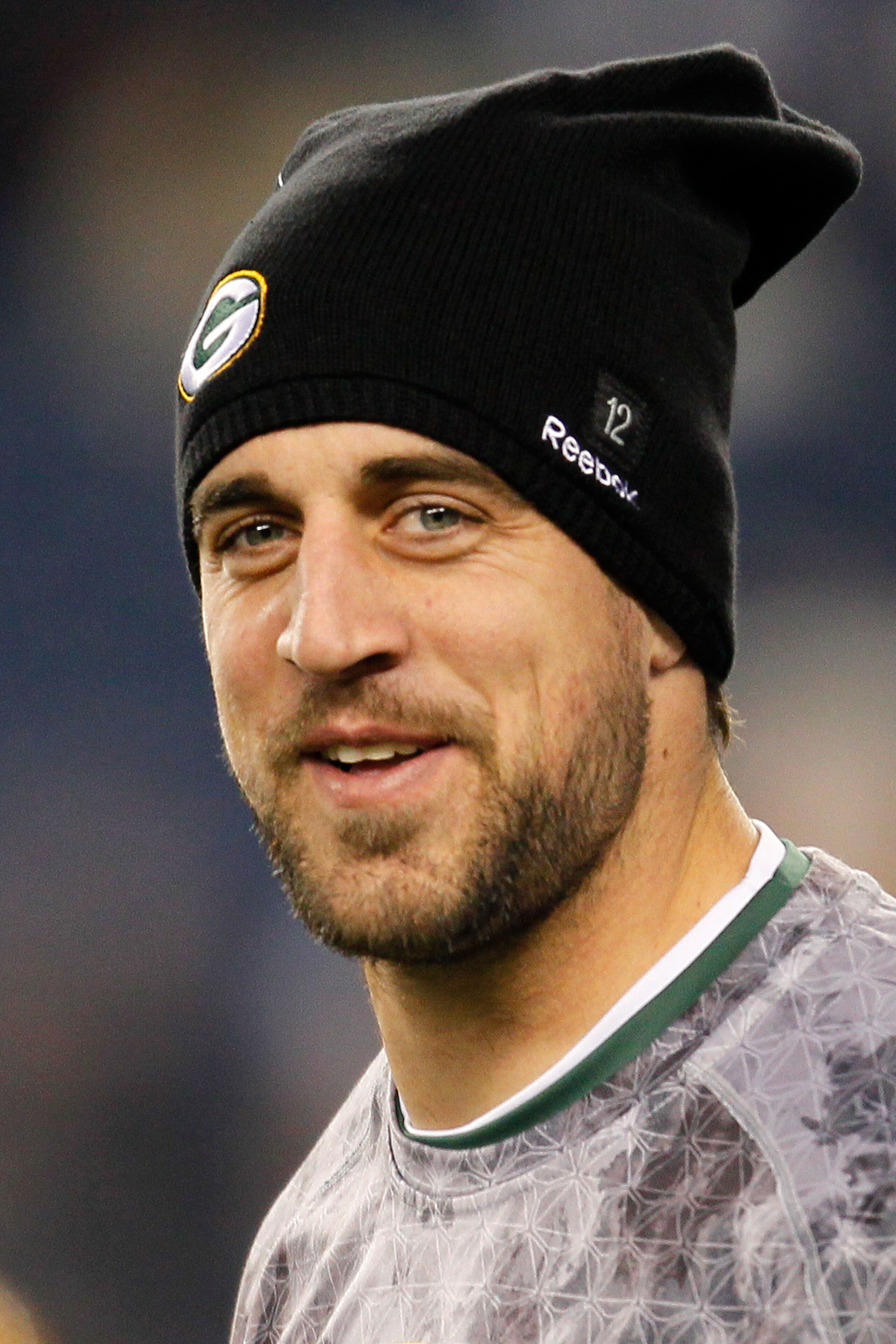 FOXBORO, MA - DECEMBER 19:  Quarterback Aaron Rodgers #12 of the Green Bay Packers, inactive due to an injury, looks on during warm-ups before the game against the New England Patriots at Gillette Stadium on December 19, 2010 in Foxboro, Massachusetts.  (