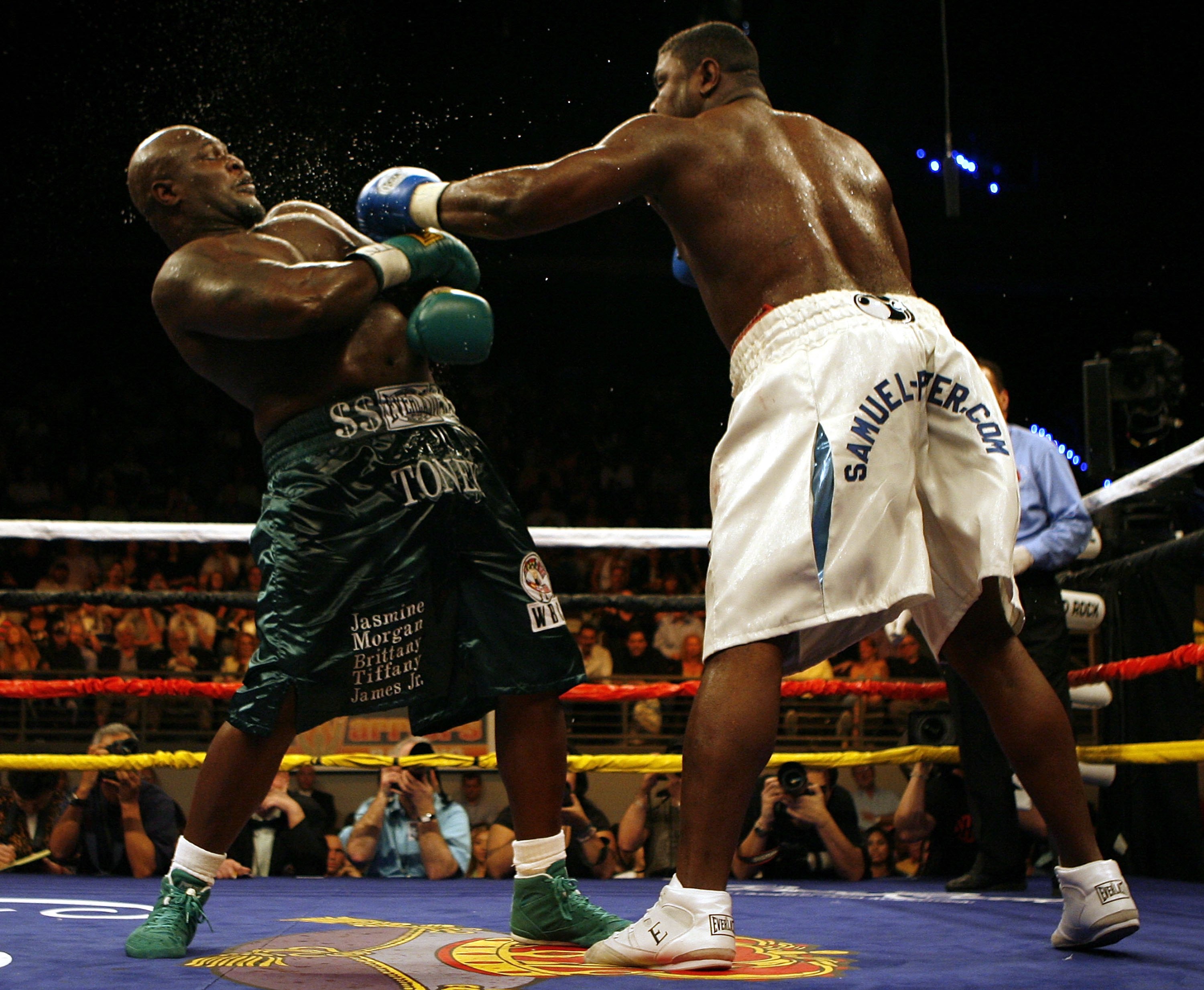HOLLYWOOD, FL - JANUARY 06:  Samuel 'Nigerian Nightmare' Peter (R) exchanges punches during his victory by decission against James ' Lights Out' Toney in a WBC heavyweight title eliminator fight at the Hard Rock Hotel and Casino January 6, 2007 in Hollywo