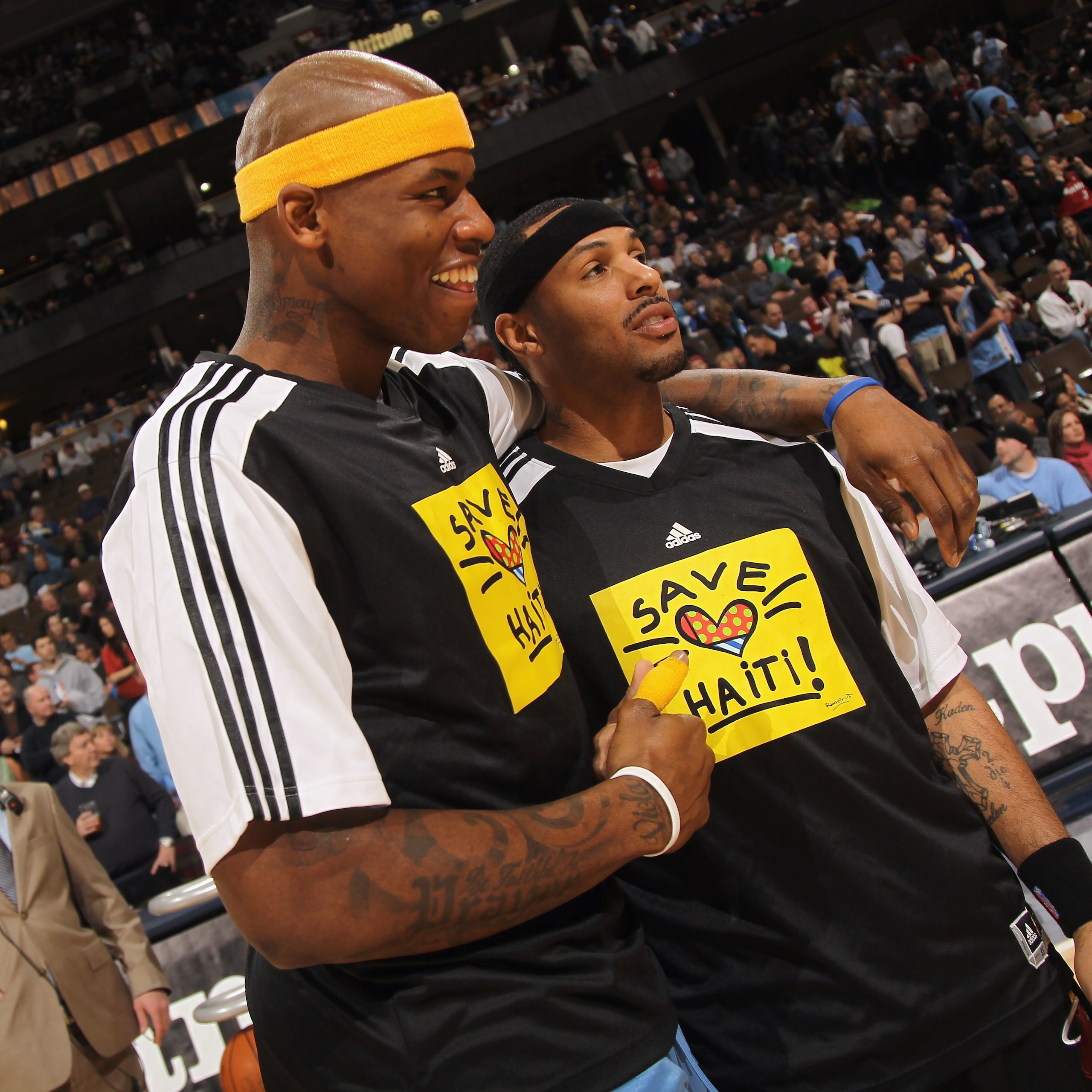 DENVER, CO - JANUARY 13:  (L-R) Al Harrington #7 of the Denver Nuggets and Eddie House #55 of the Miami Heat show off their shirts as the teams warmed up in 'Save Haiti' shirts to promote the Haiti Relief Fund at the Pepsi Center on January 13, 2011 in De