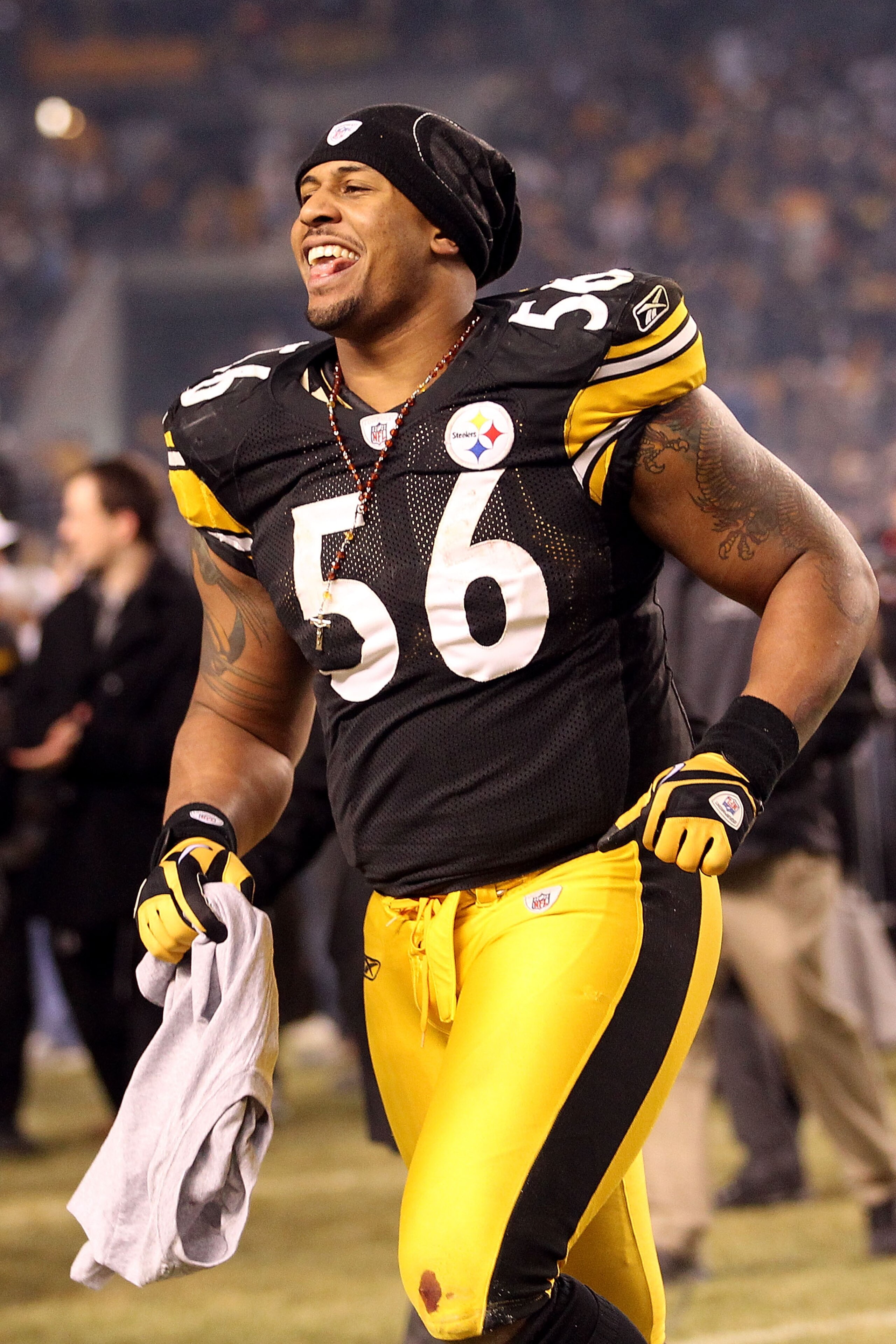 PITTSBURGH, PA - JANUARY 23:  LaMarr Woodley #56 of the Pittsburgh Steelers celebrates their 24 to 19 win over the New York Jets in the 2011 AFC Championship game at Heinz Field on January 23, 2011 in Pittsburgh, Pennsylvania.  (Photo by Ronald Martinez/G